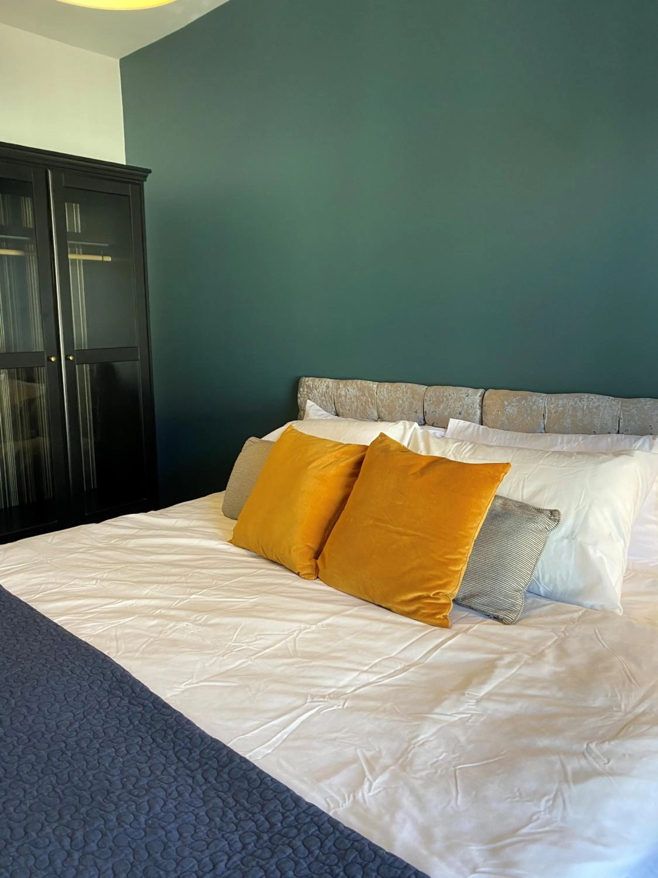 Bed in Raby Apartment