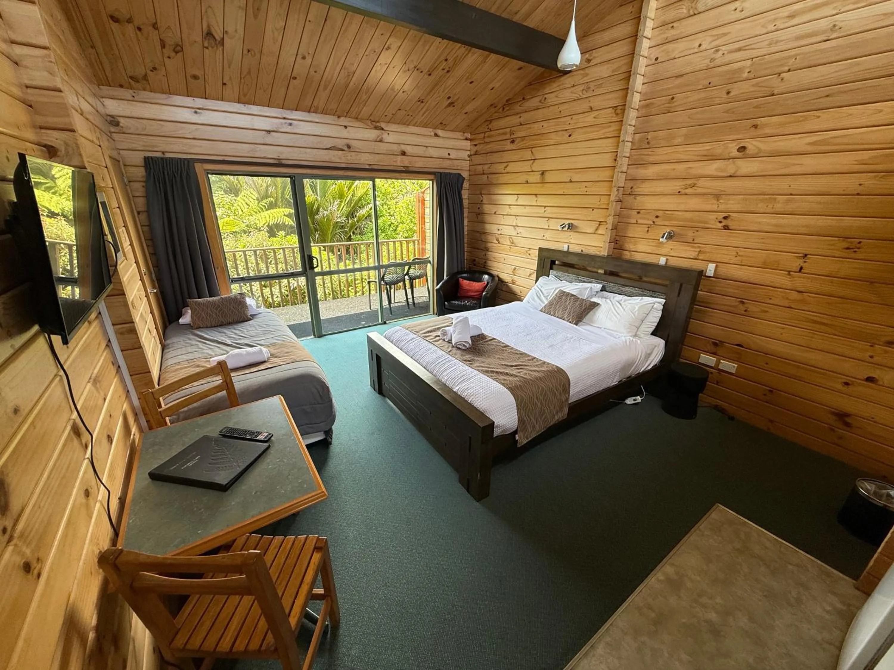 Bed in Paparoa Park Motel