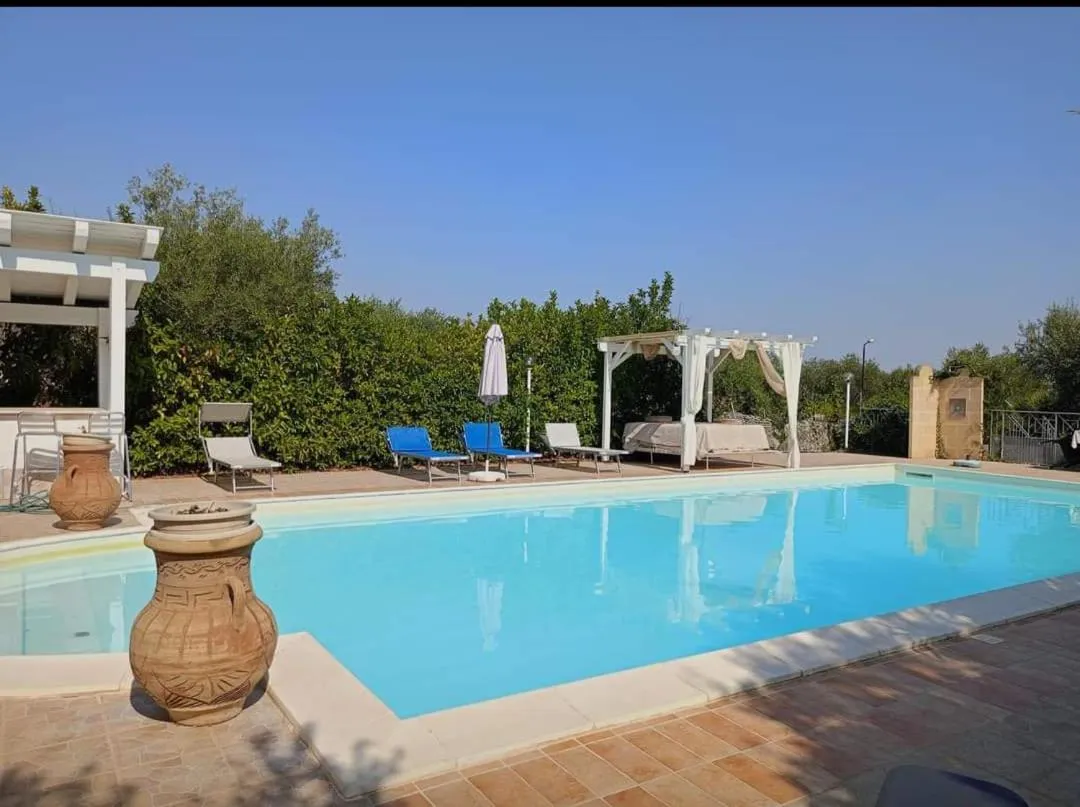 Swimming pool in L'Isola Felice e Trulli Sotto Le Stelle