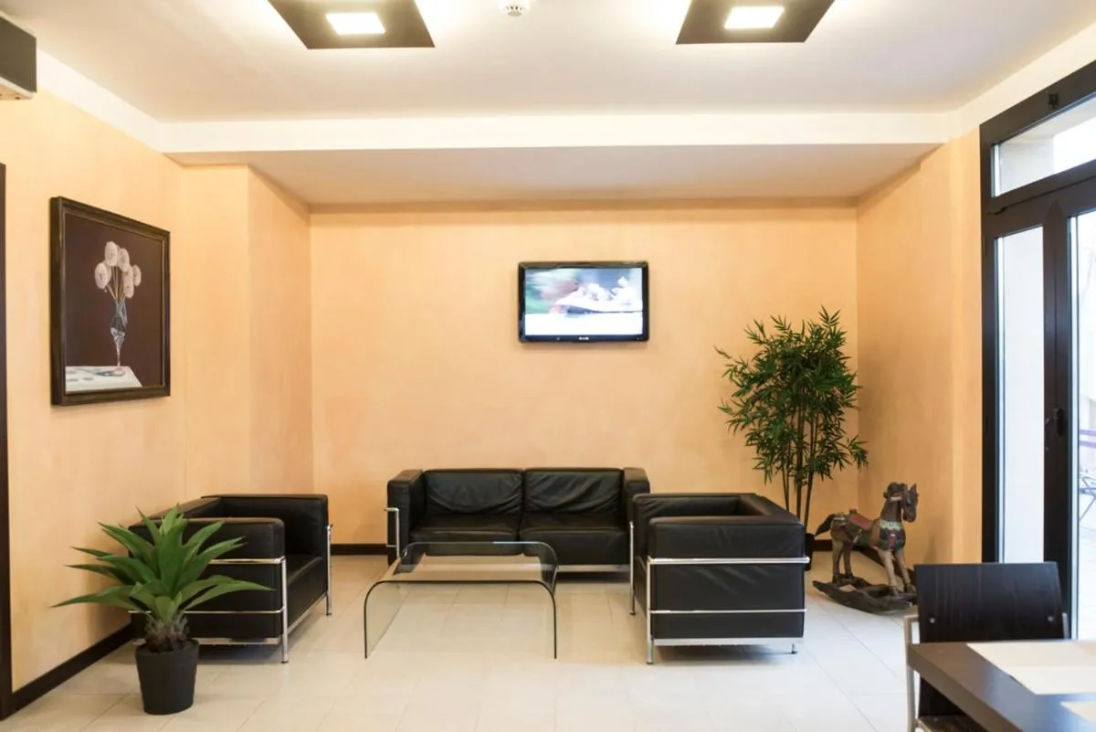 Communal lounge/ TV room in Hotel Corte Business