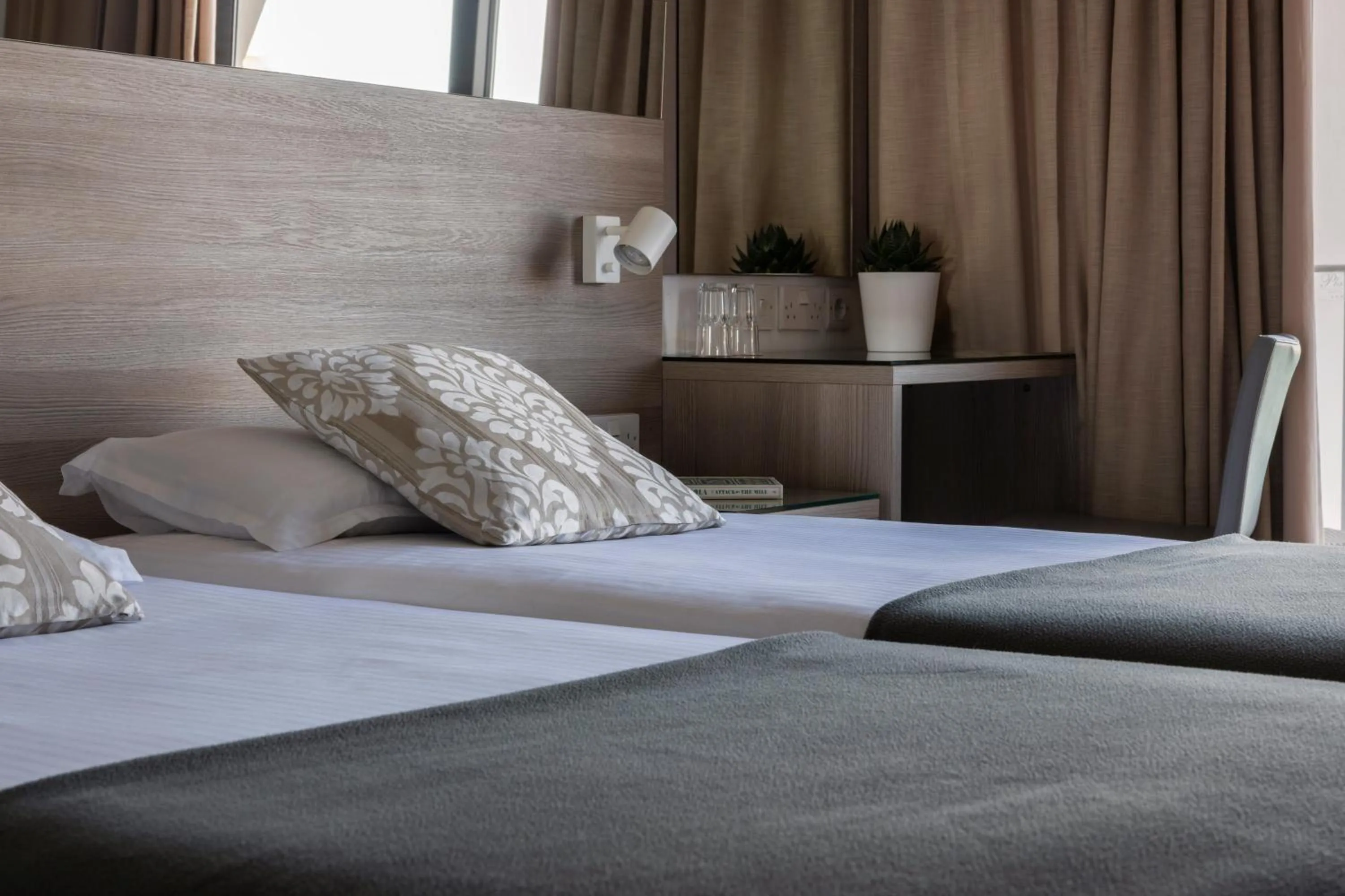 Bed in Plaza Regency Hotels