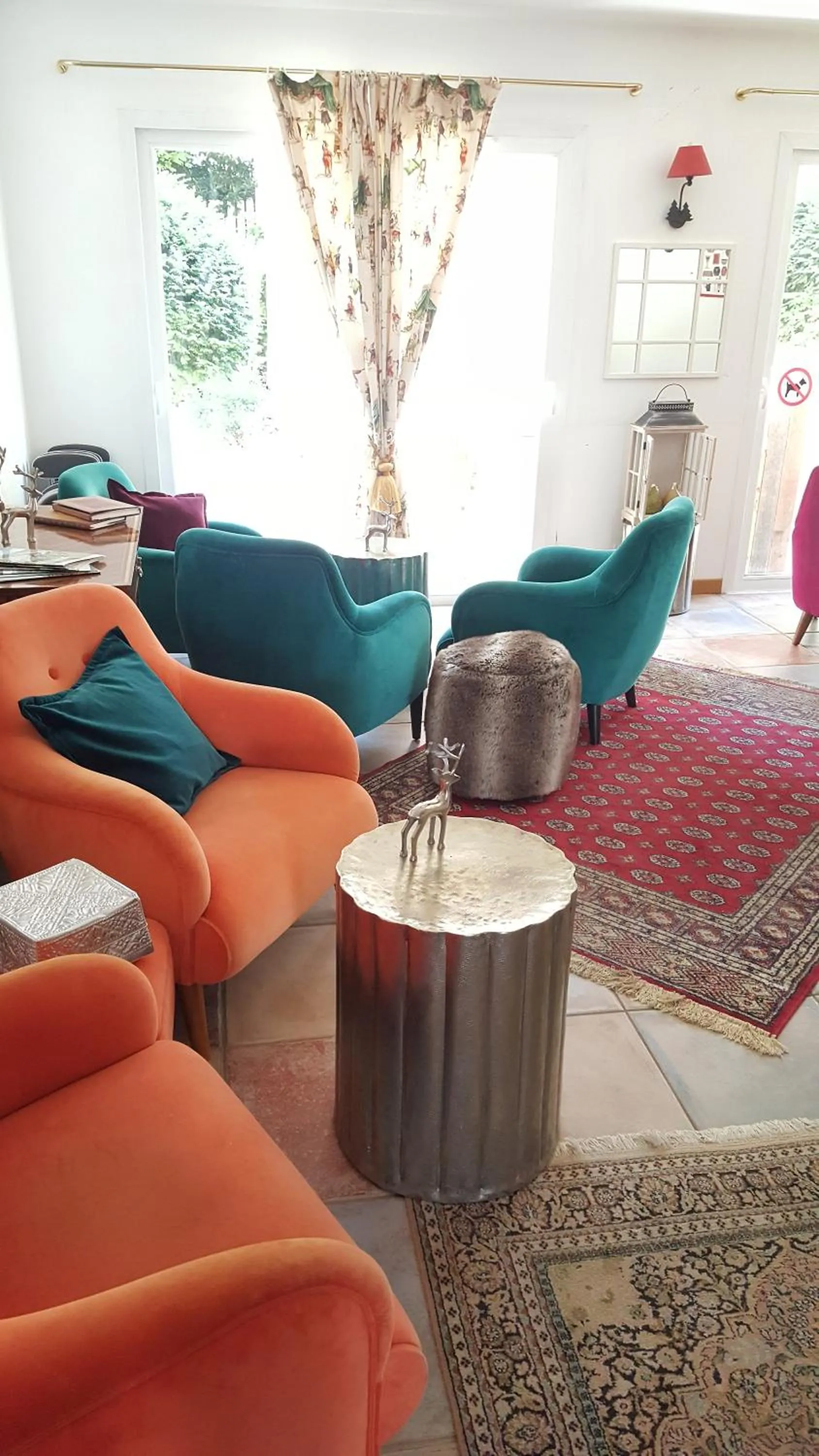 Communal lounge/ TV room in Logis Hôtel La Villa Boucicaut