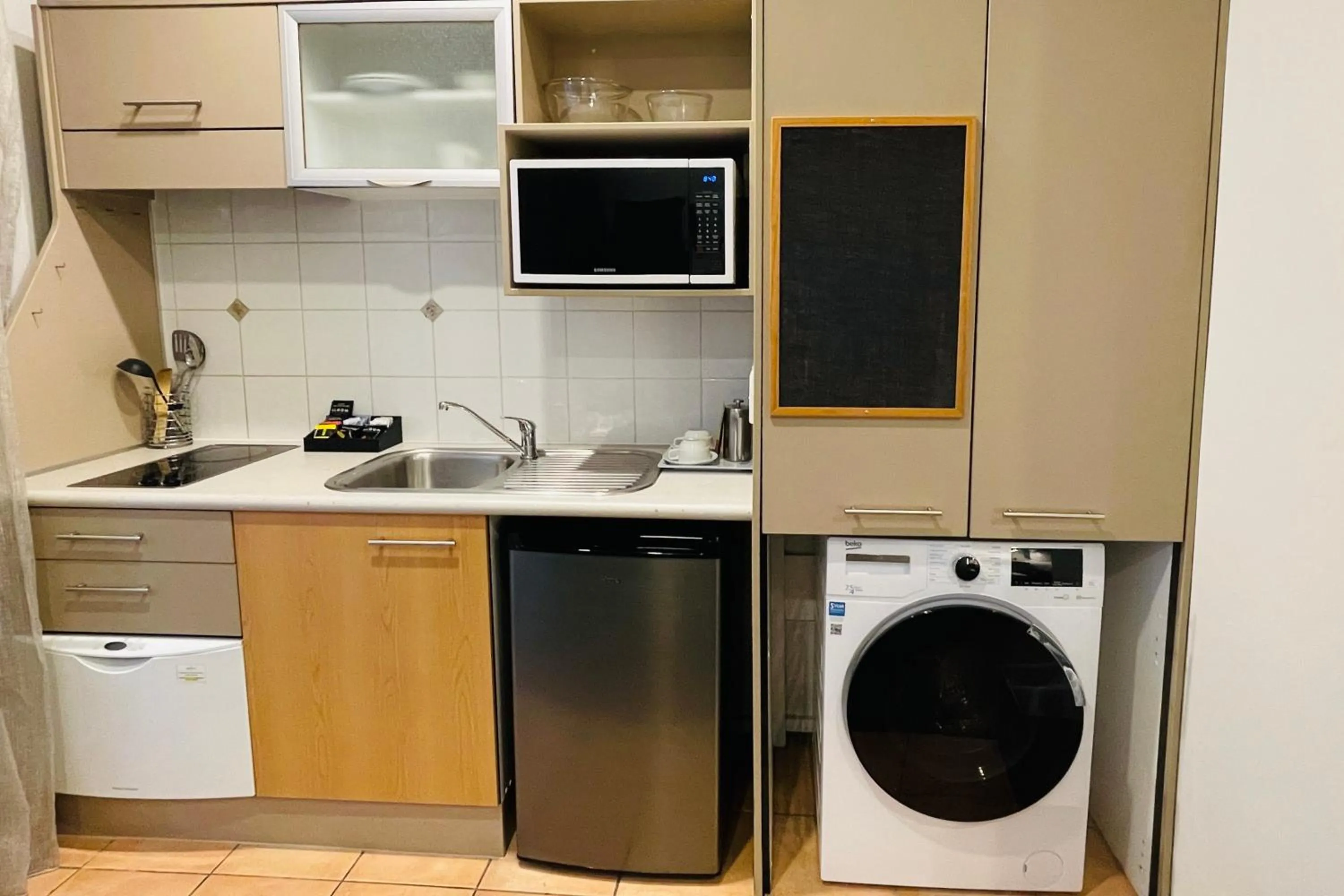 Kitchen or kitchenette in Quest Atrium Apartment Hotel