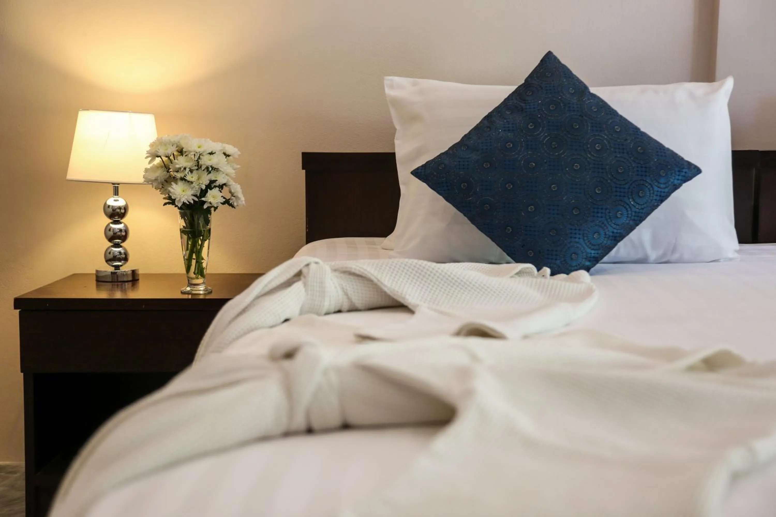 Bed in Naiharn Beach Resort - SHA Plus Extra