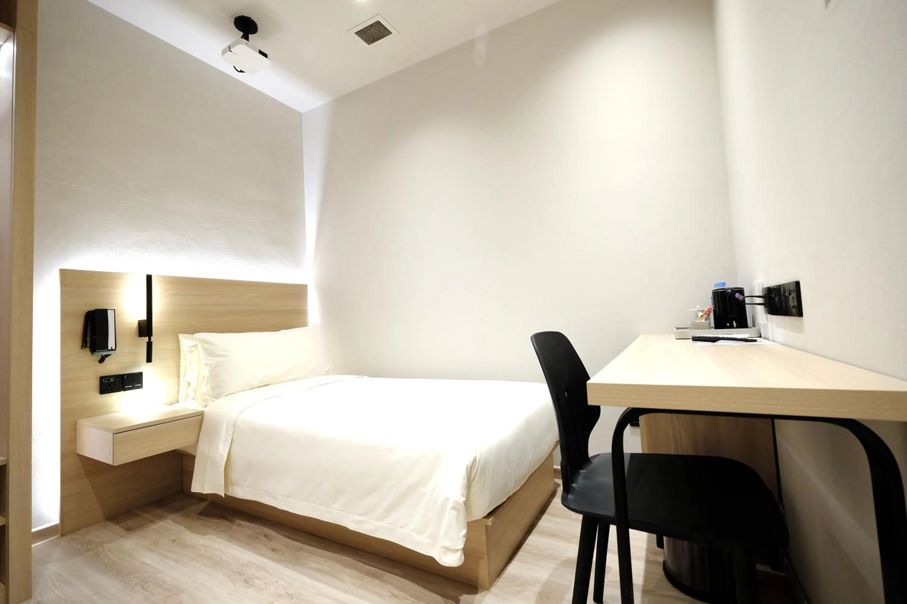 Bed in Rest Bugis Hotel