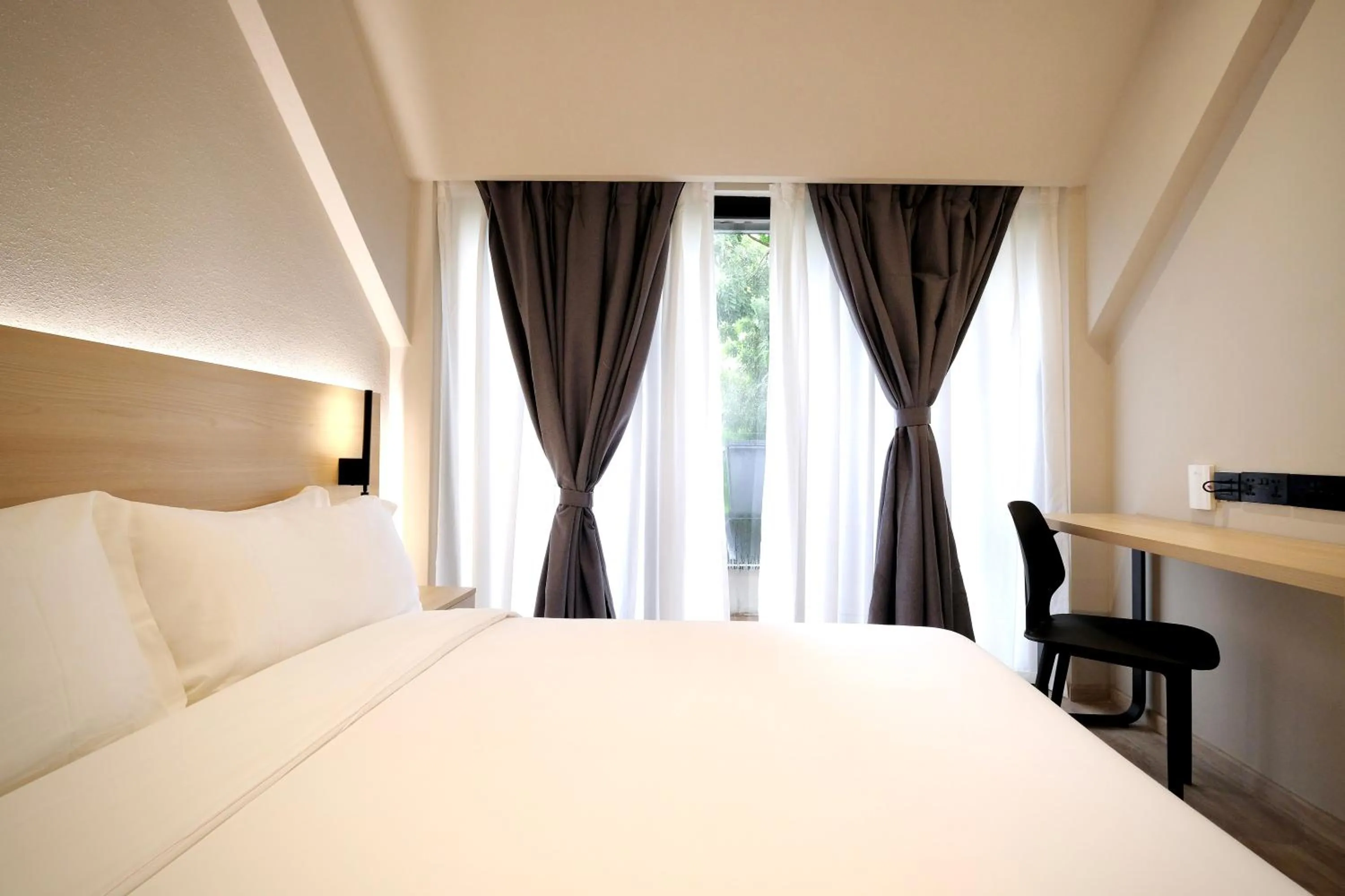 Bed in Rest Bugis Hotel