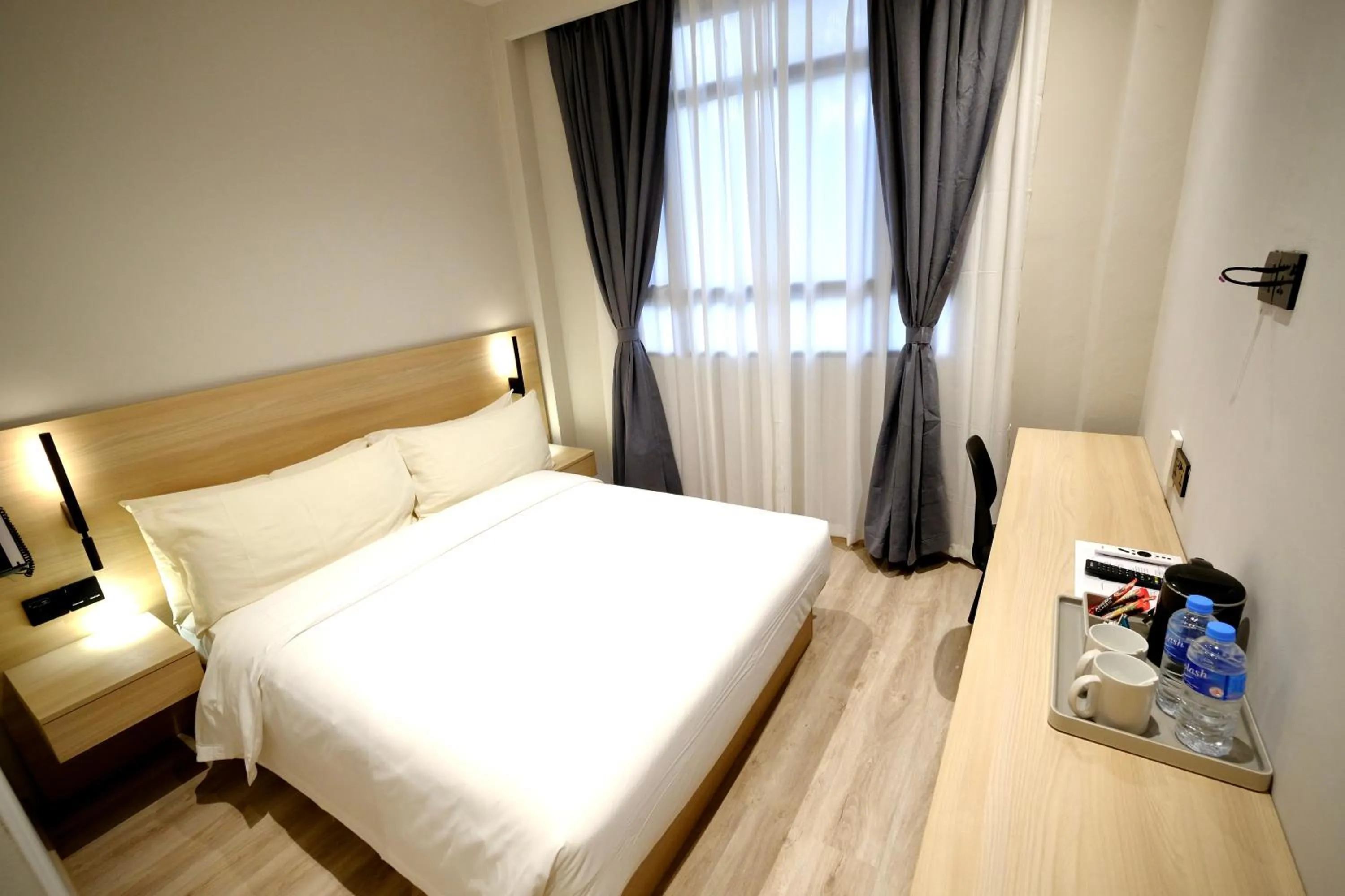 Bed in Rest Bugis Hotel