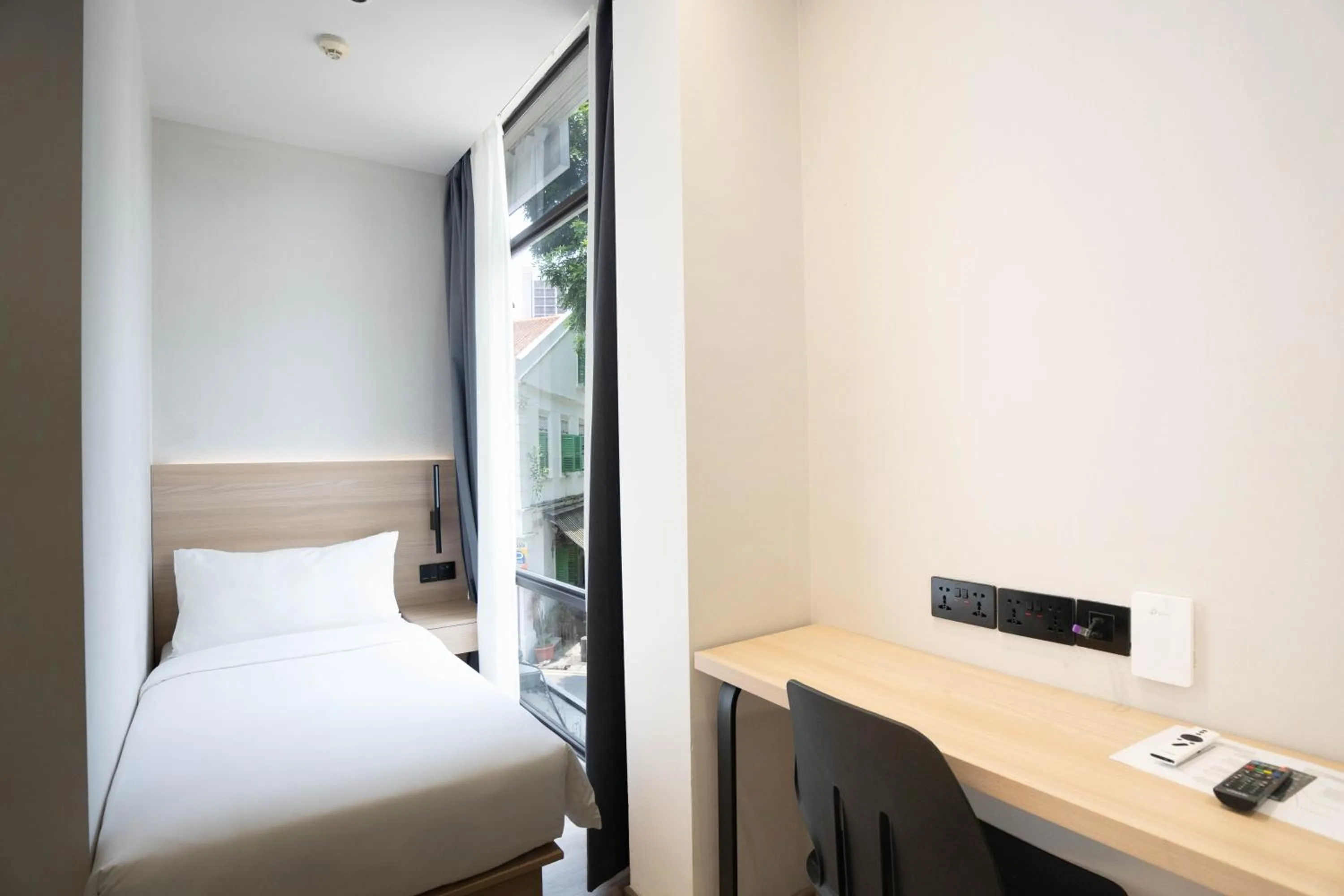 Bed in Rest Bugis Hotel