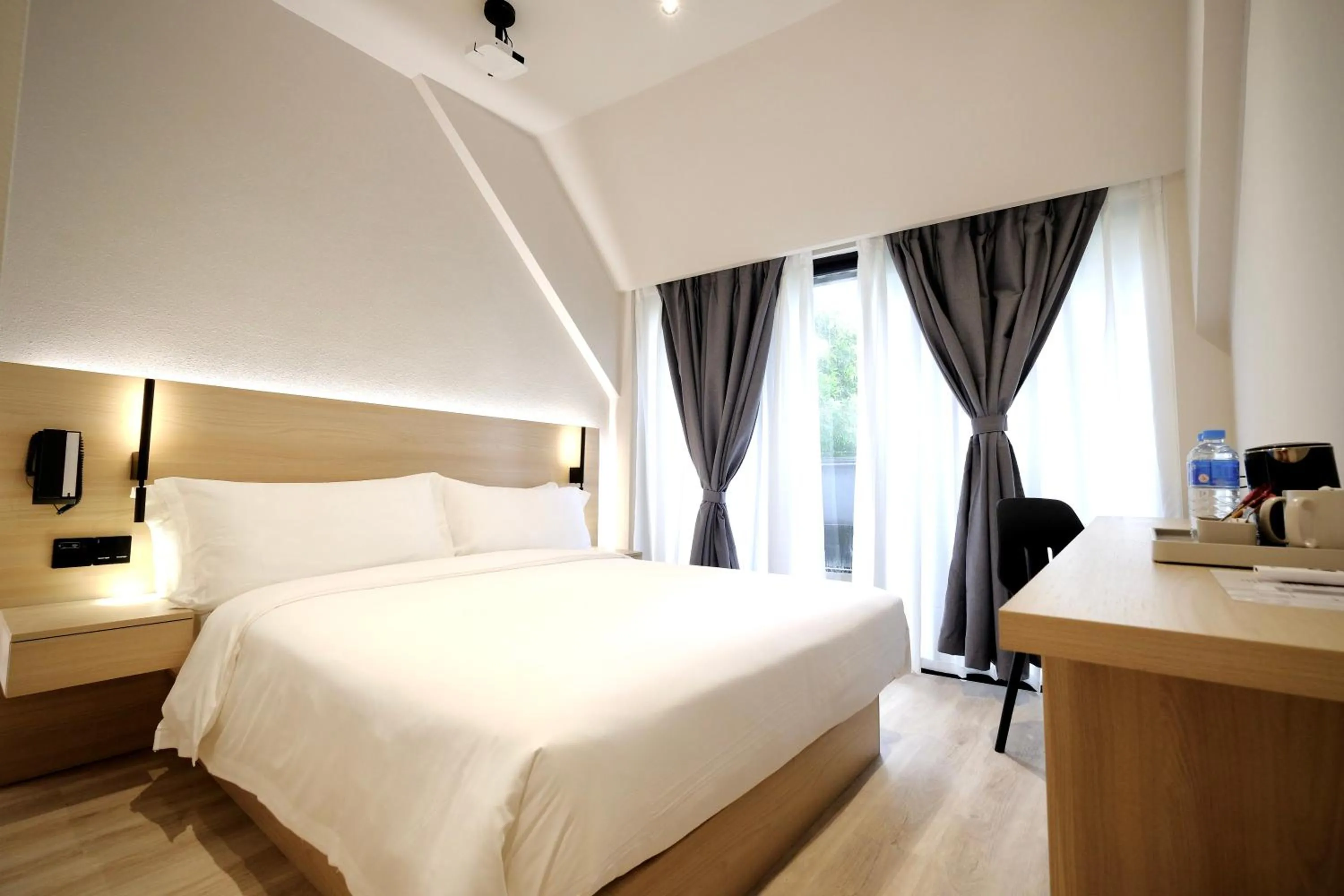 Bed in Rest Bugis Hotel