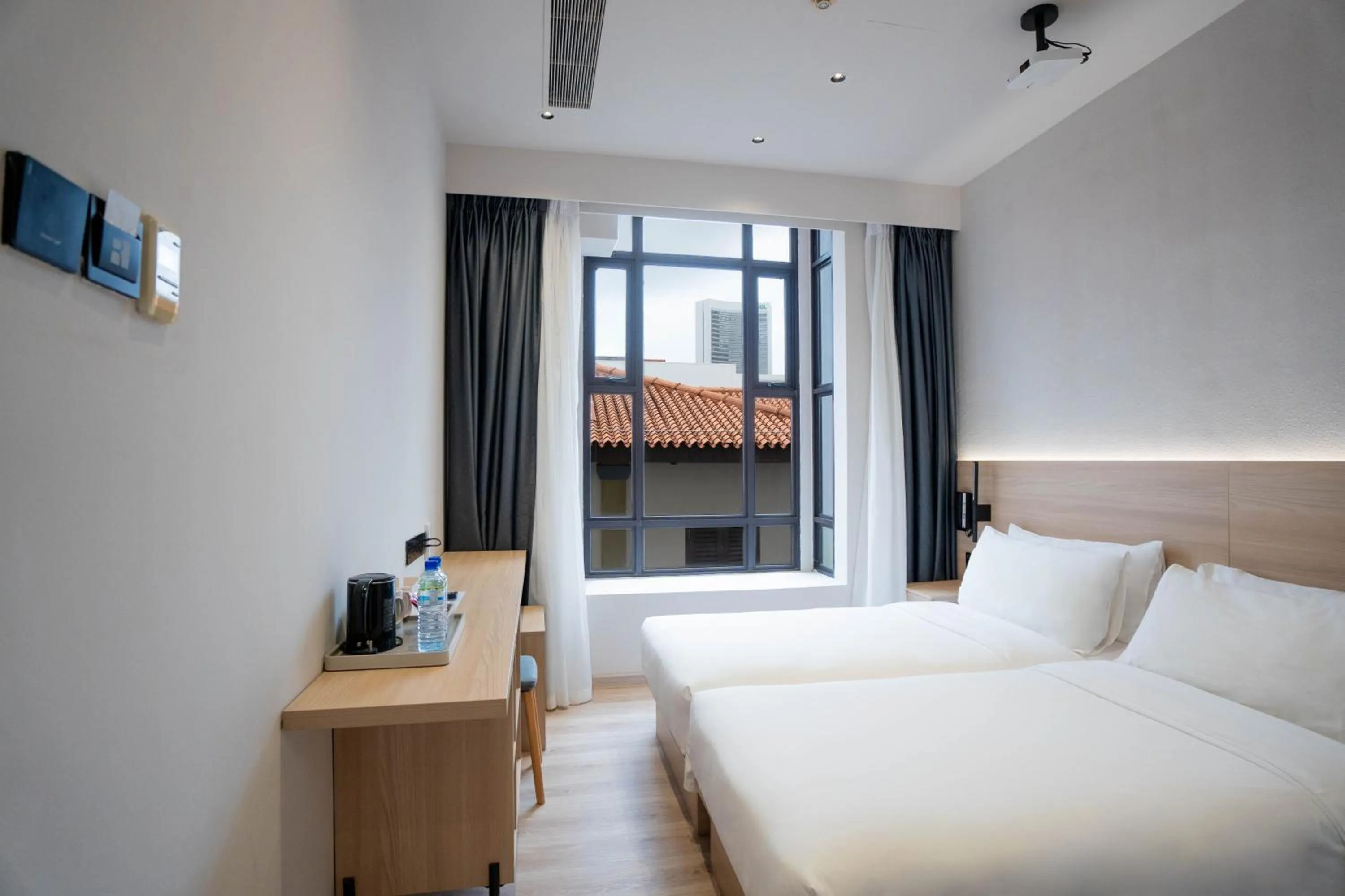 Bed in Rest Bugis Hotel