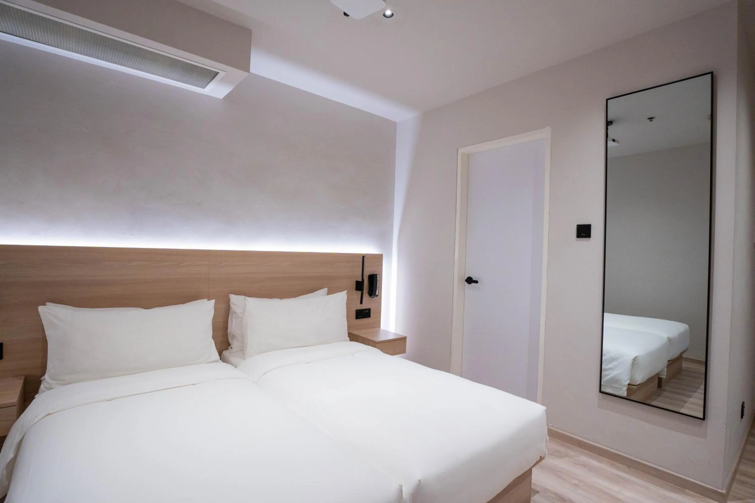 Bed in Rest Bugis Hotel