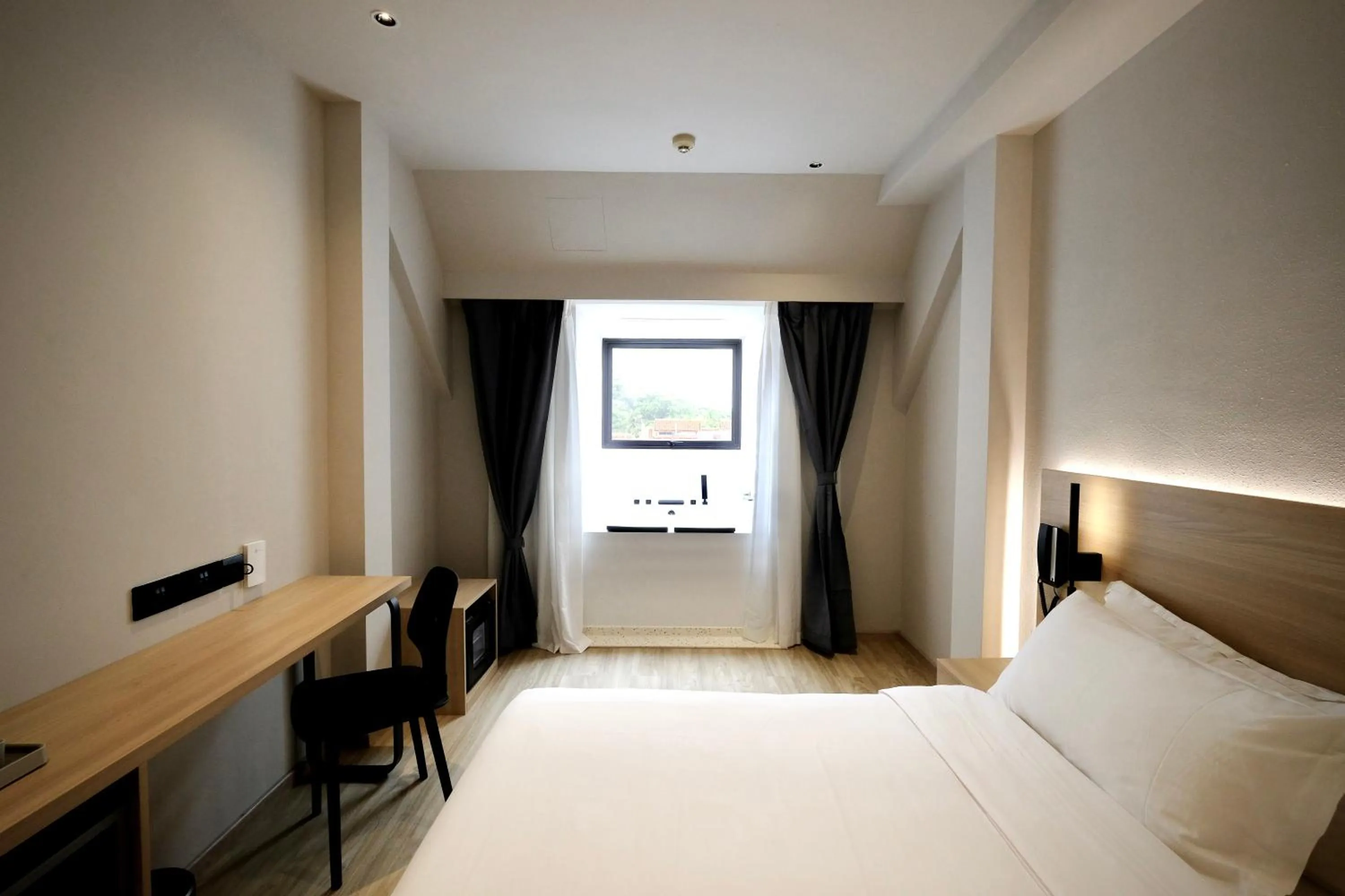 Bed in Rest Bugis Hotel