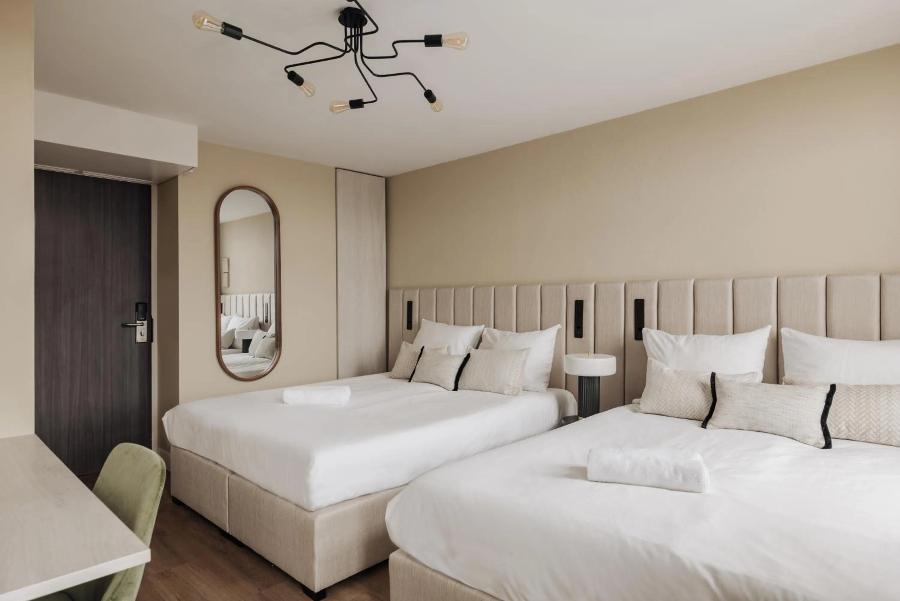 Bed in Adam Suites Hotel