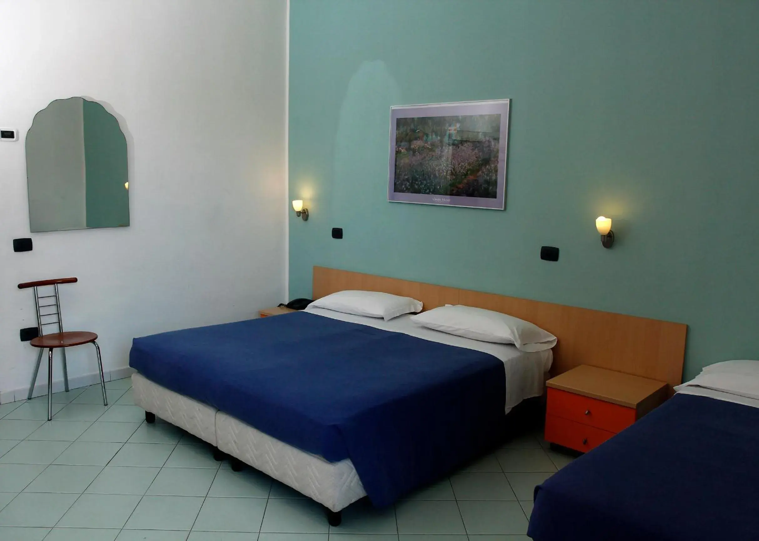 Quadruple Room in Hotel Residence La Darsena Quadruple Room in Hotel Residence La Darsena