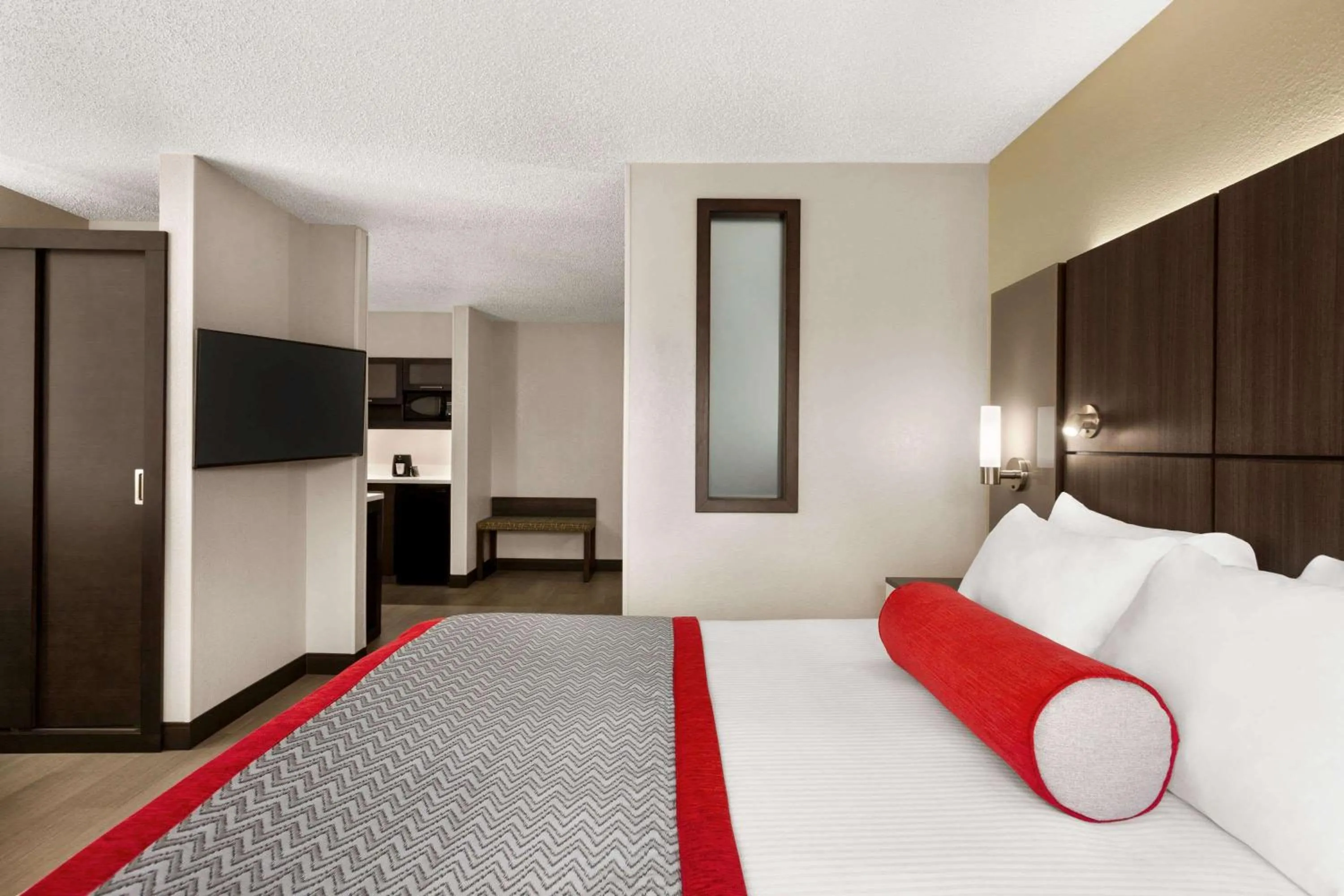 Photo of the whole room, Bed in Ramada by Wyndham Suites Orlando Airport- Free Airport Shuttle