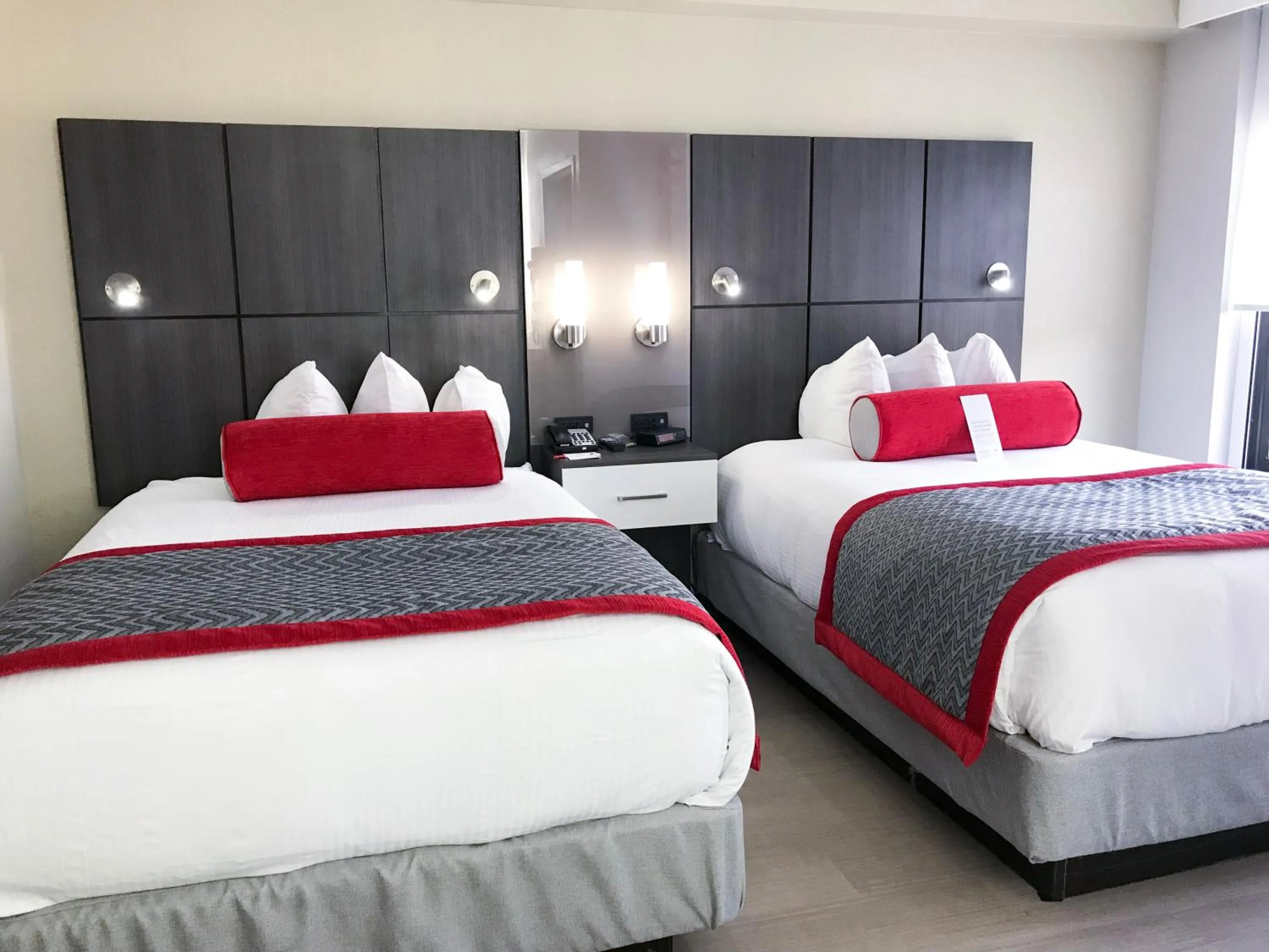 Bedroom, Bed in Ramada by Wyndham Suites Orlando Airport- Free Airport Shuttle
