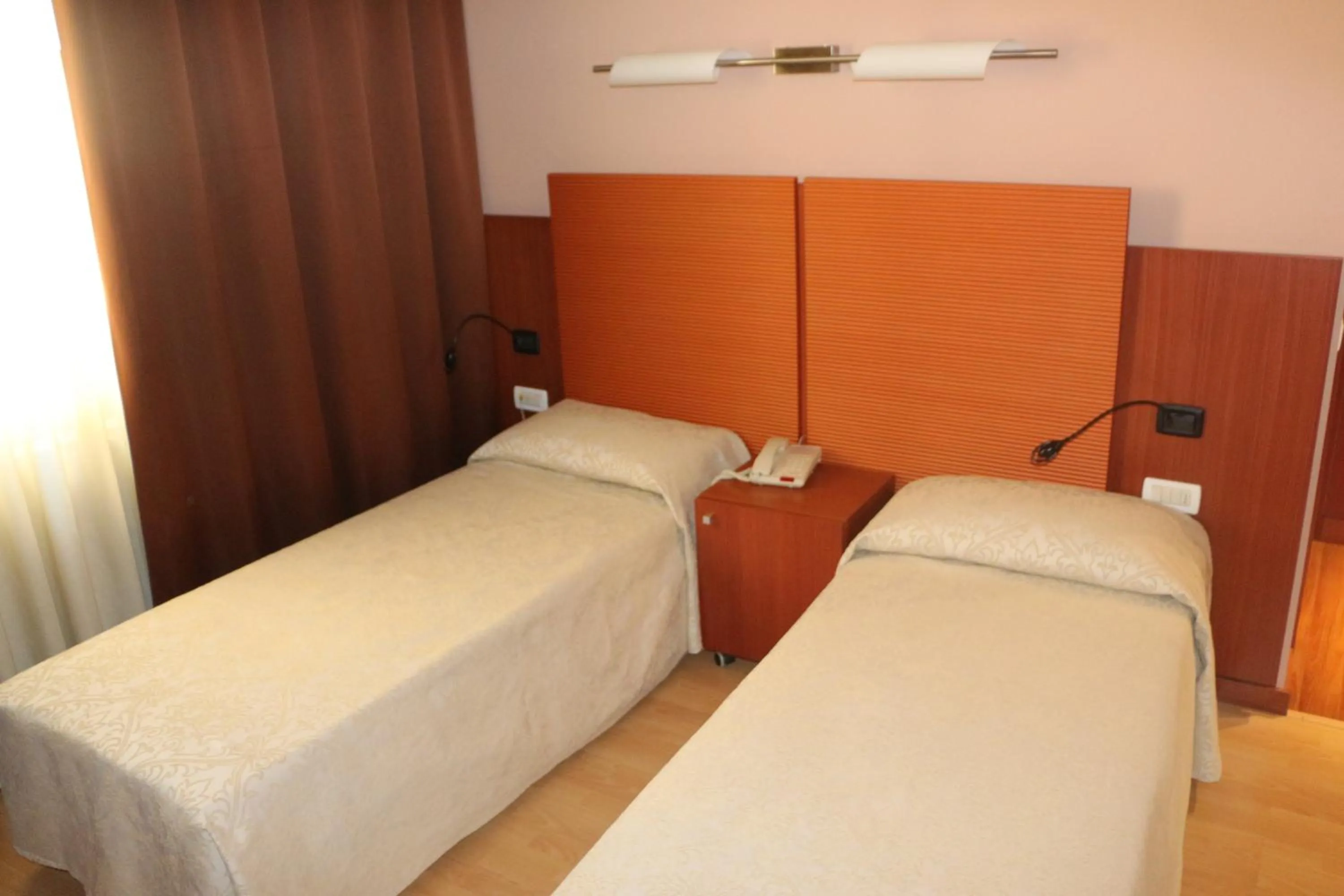 Bed in Bella Italia Palace Hotel