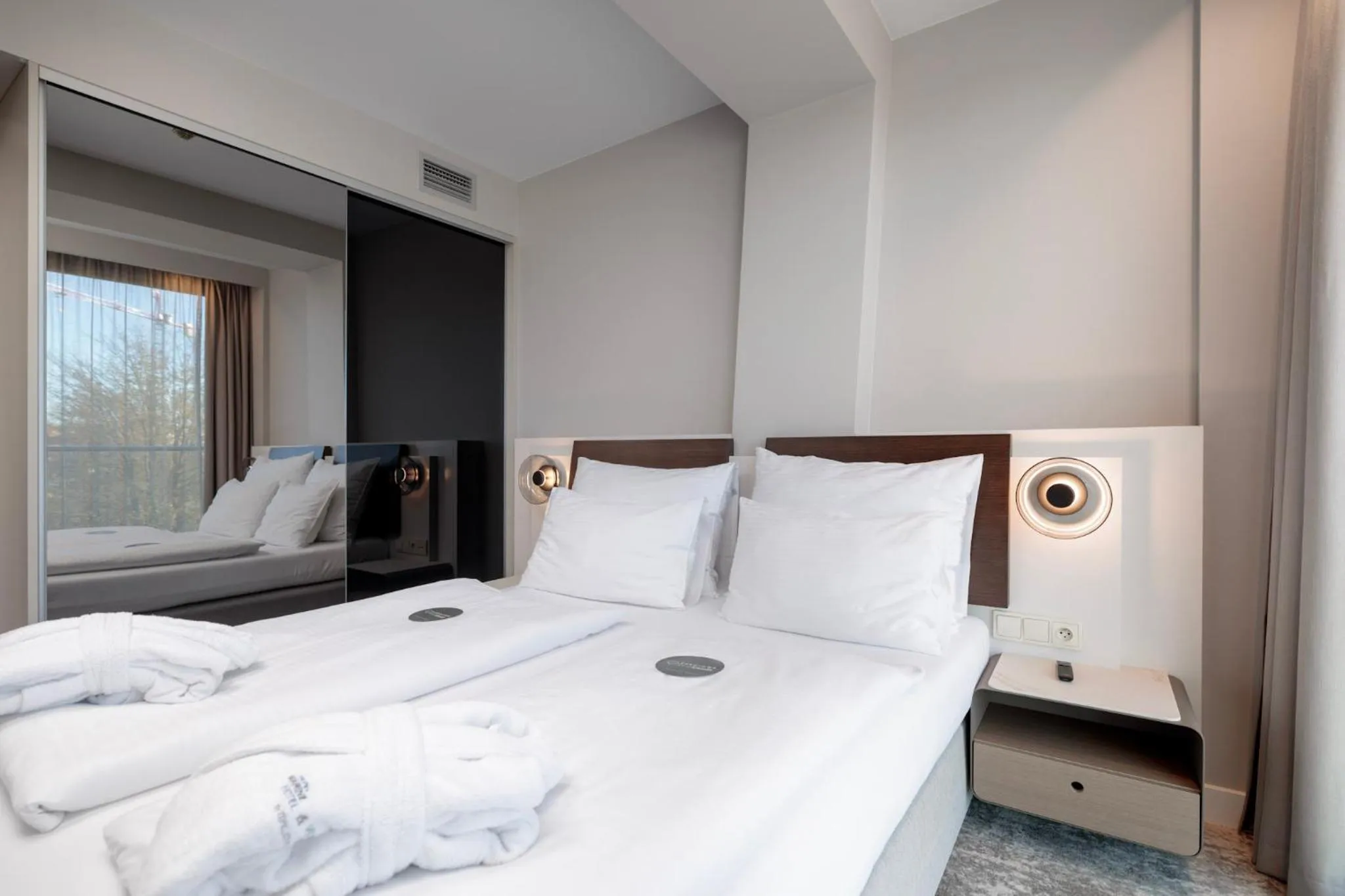 Bed in Marine Hotel by Zdrojowa