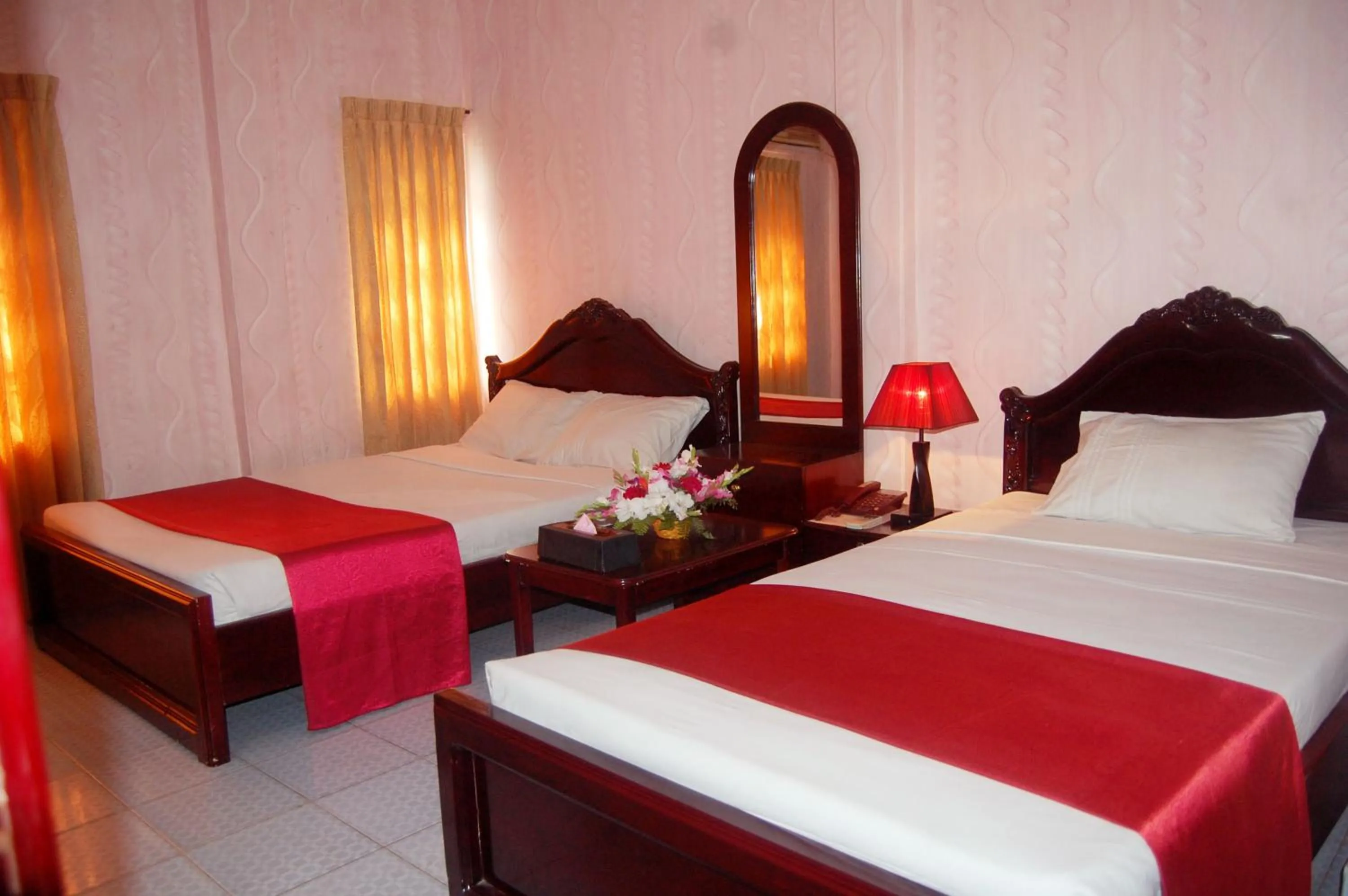 Bed in Hotel Swiss Garden International