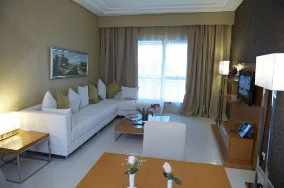 Living room, Bed in Grand Bellevue Hotel Apartment Dubai