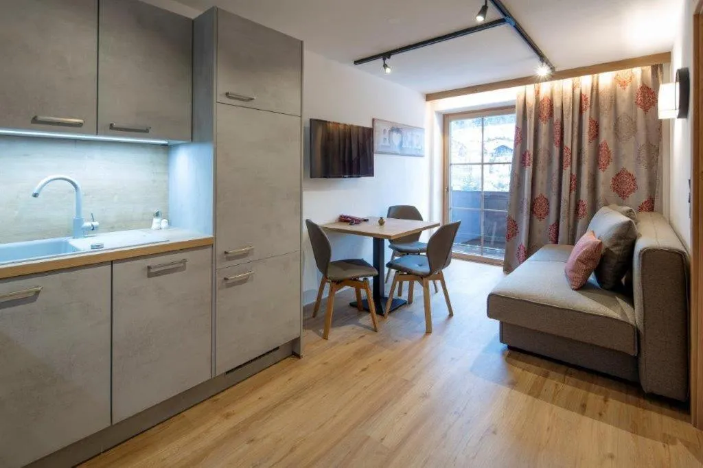 Kitchen or kitchenette, Bed in Hotel Gasthof Obermair