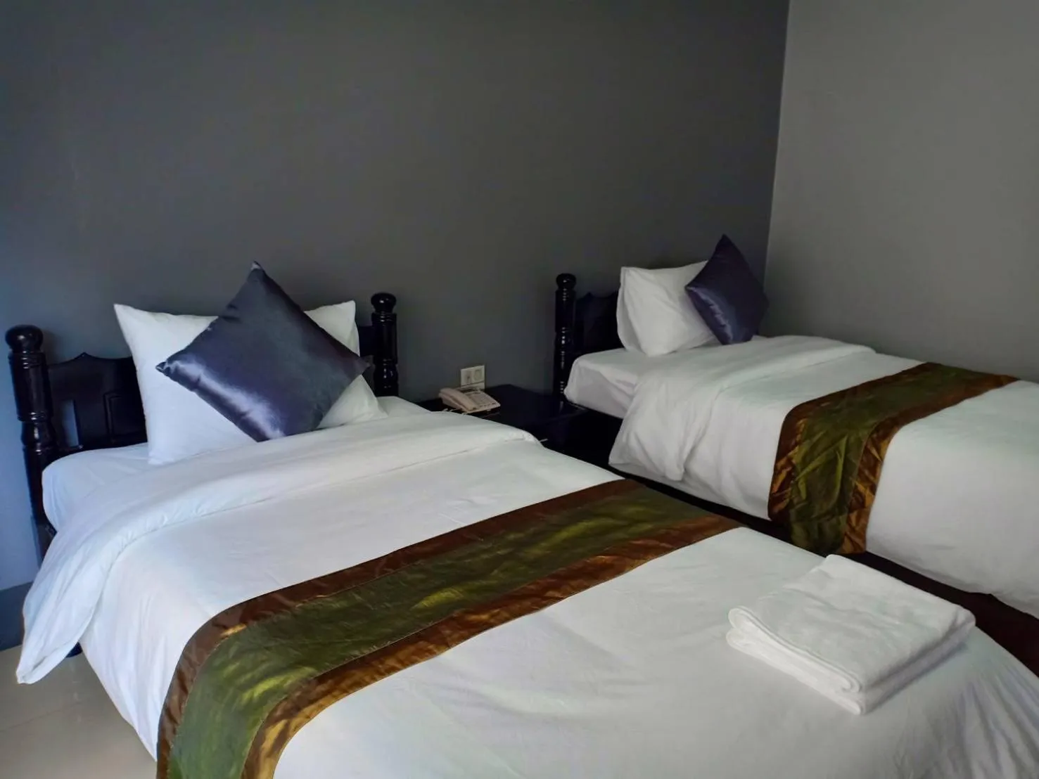 Bed in Submukda Phoomplace Hotel