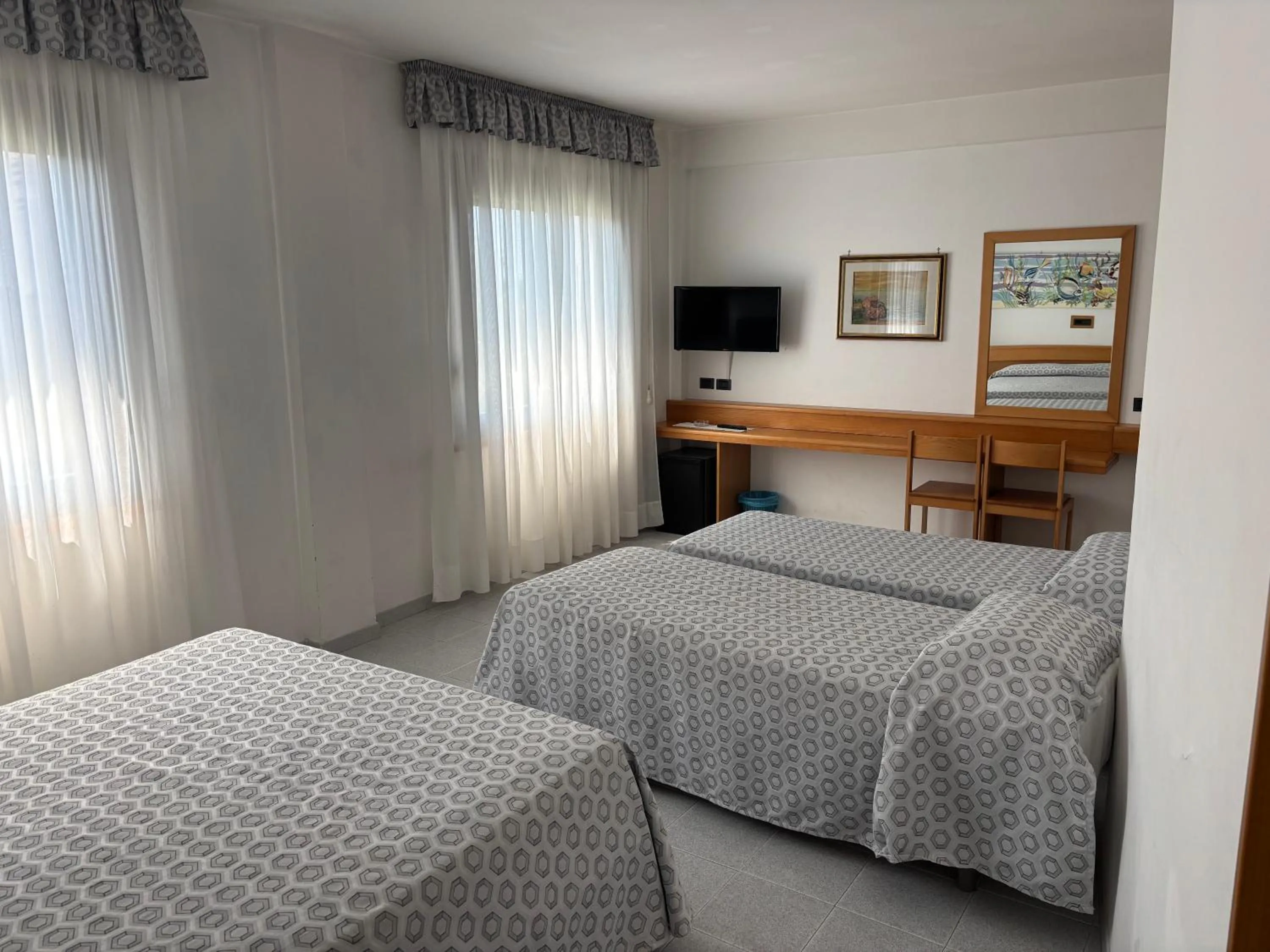 Bed in Hotel Le Palme