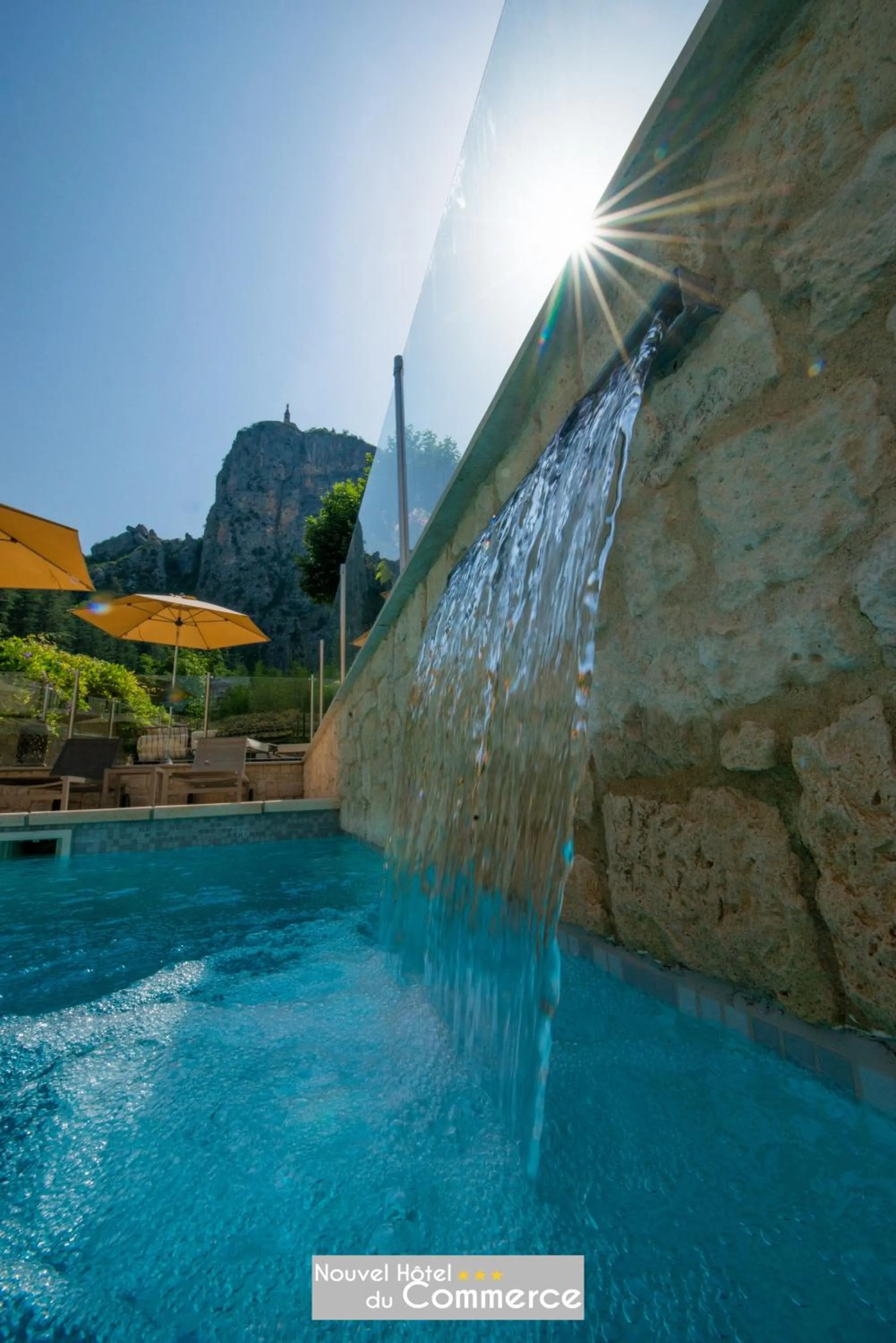 Swimming pool in Nouvel Hôtel du Commerce