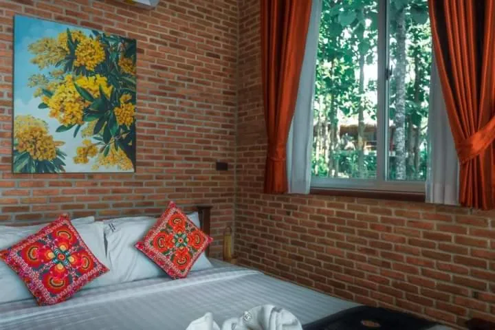 Bed in Nan De Panna Resort and Spa