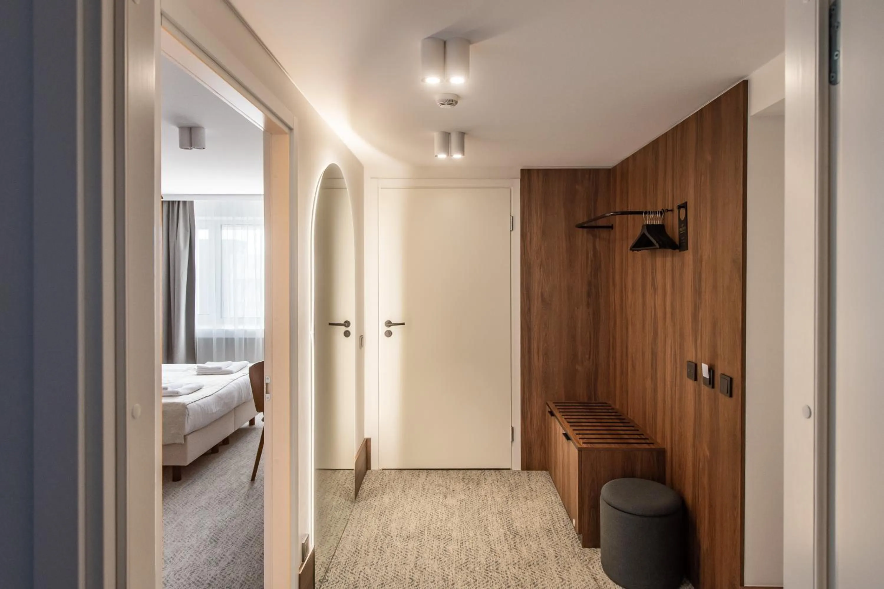 wardrobe, Bed in AIRINN Vilnius Airport Hotel RENOVATED 2025