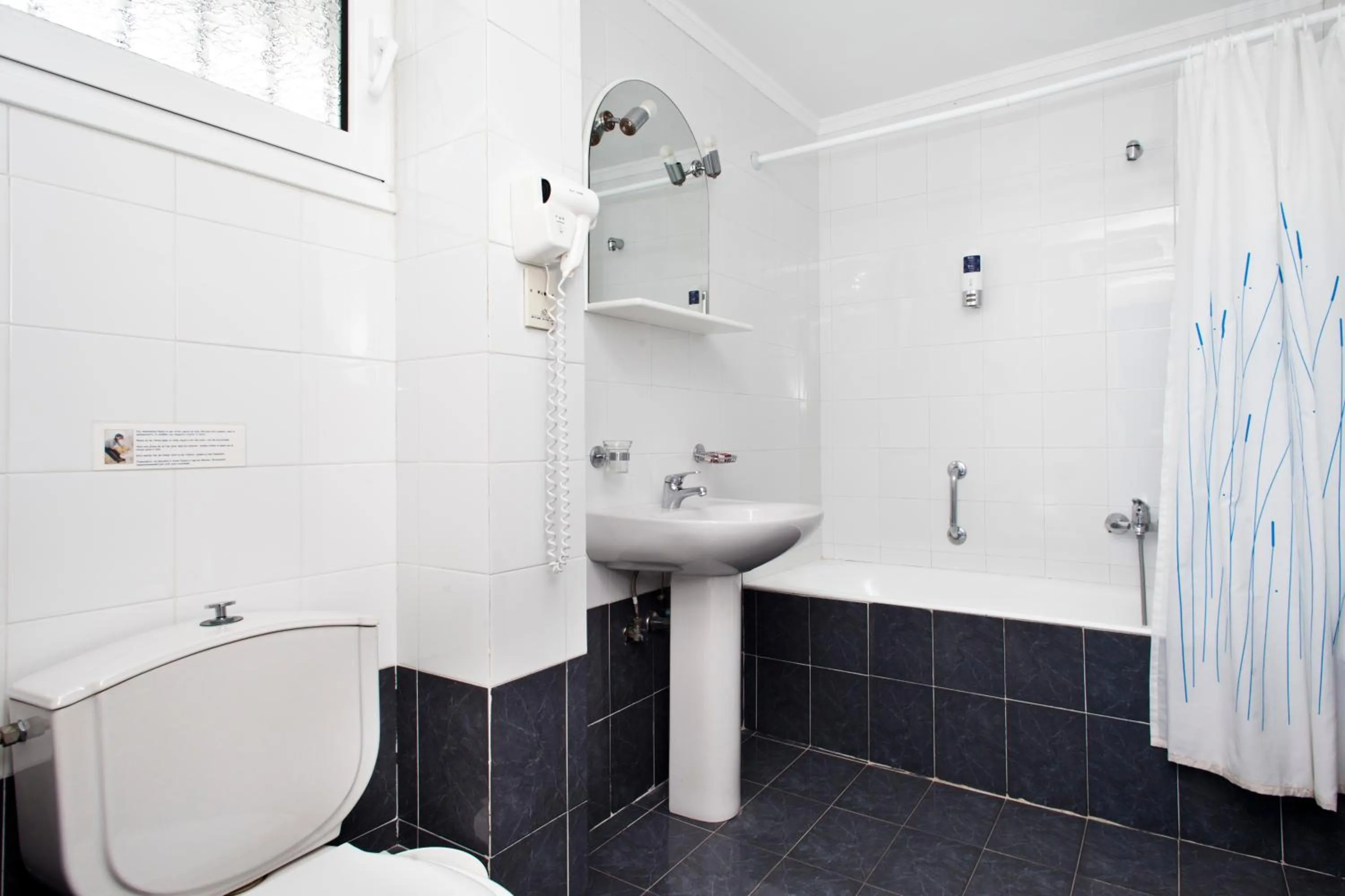 Bathroom in Daphne's Club Hotel Apartments