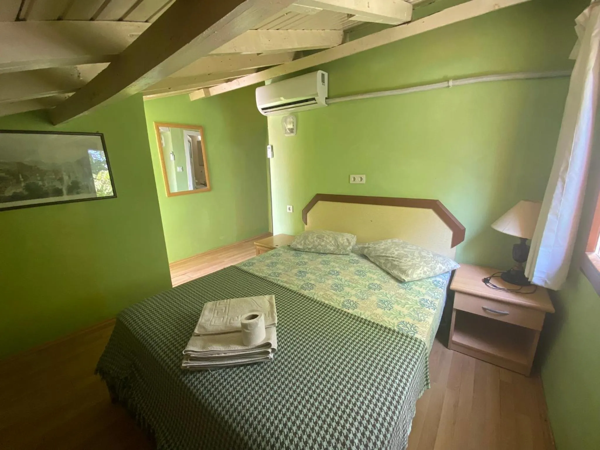 Bed in Camel Hotel & Apart