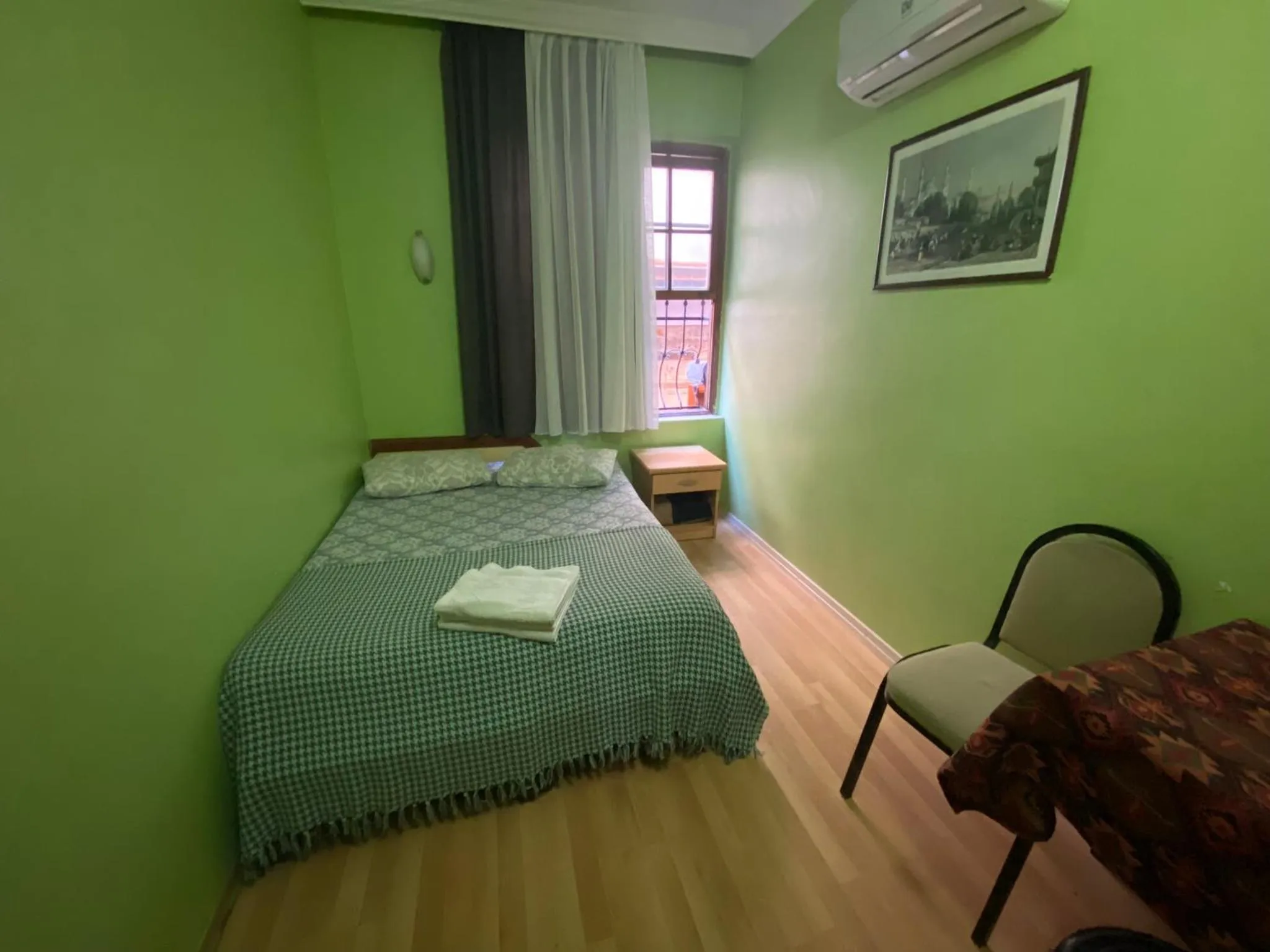 Bed in Camel Hotel & Apart