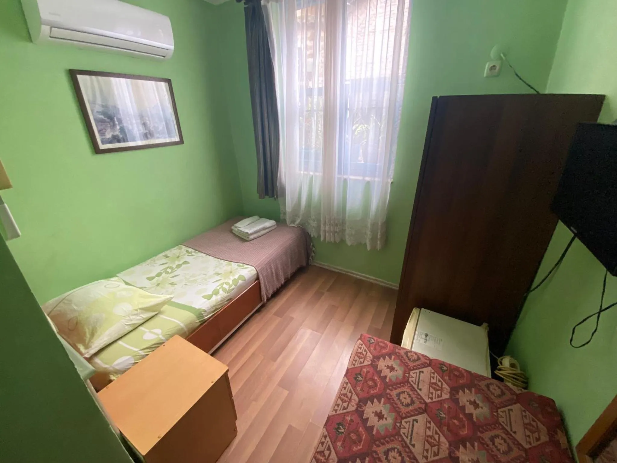 Bed in Camel Hotel & Apart