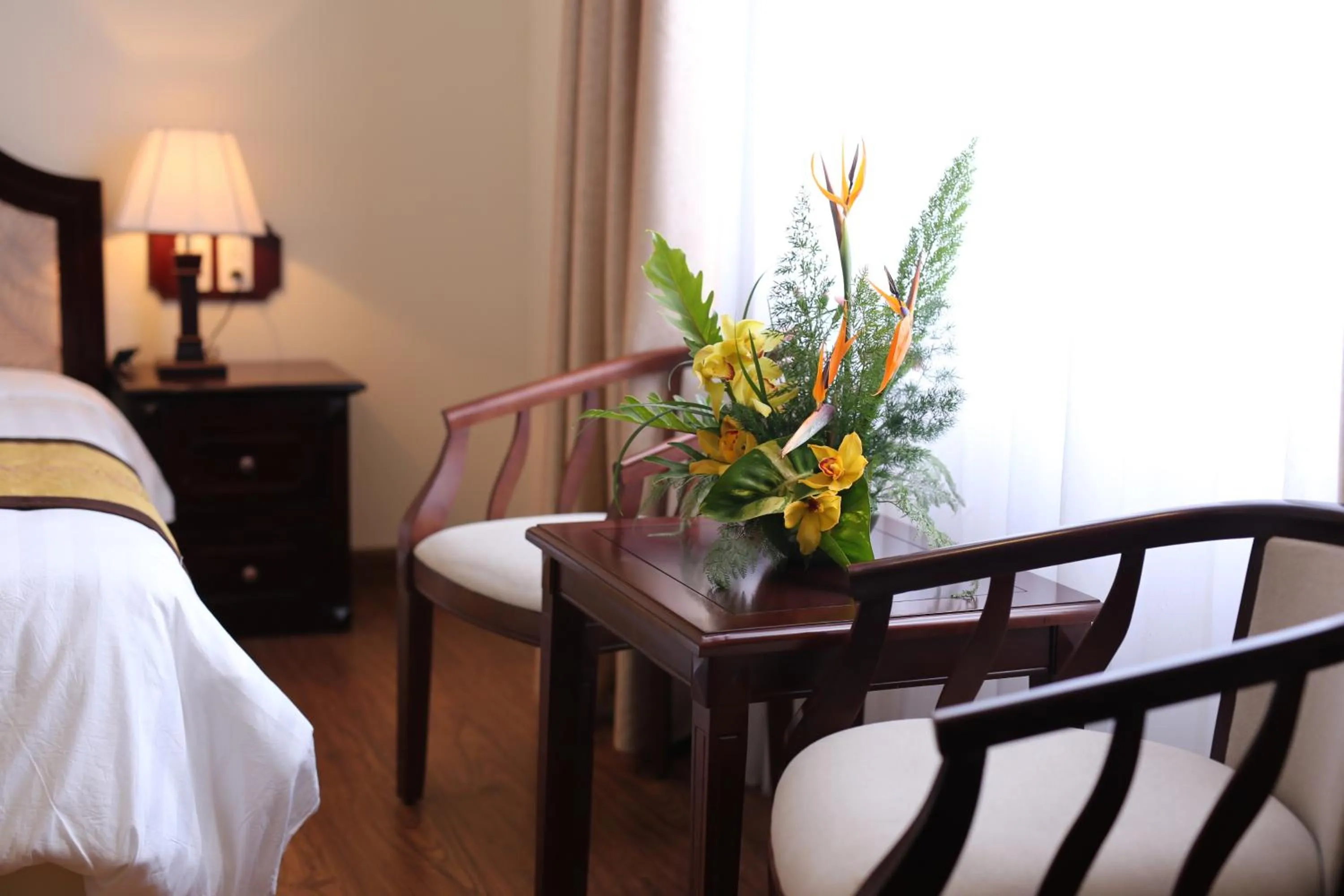 Seating area, Bed in Iris Dalat Hotel