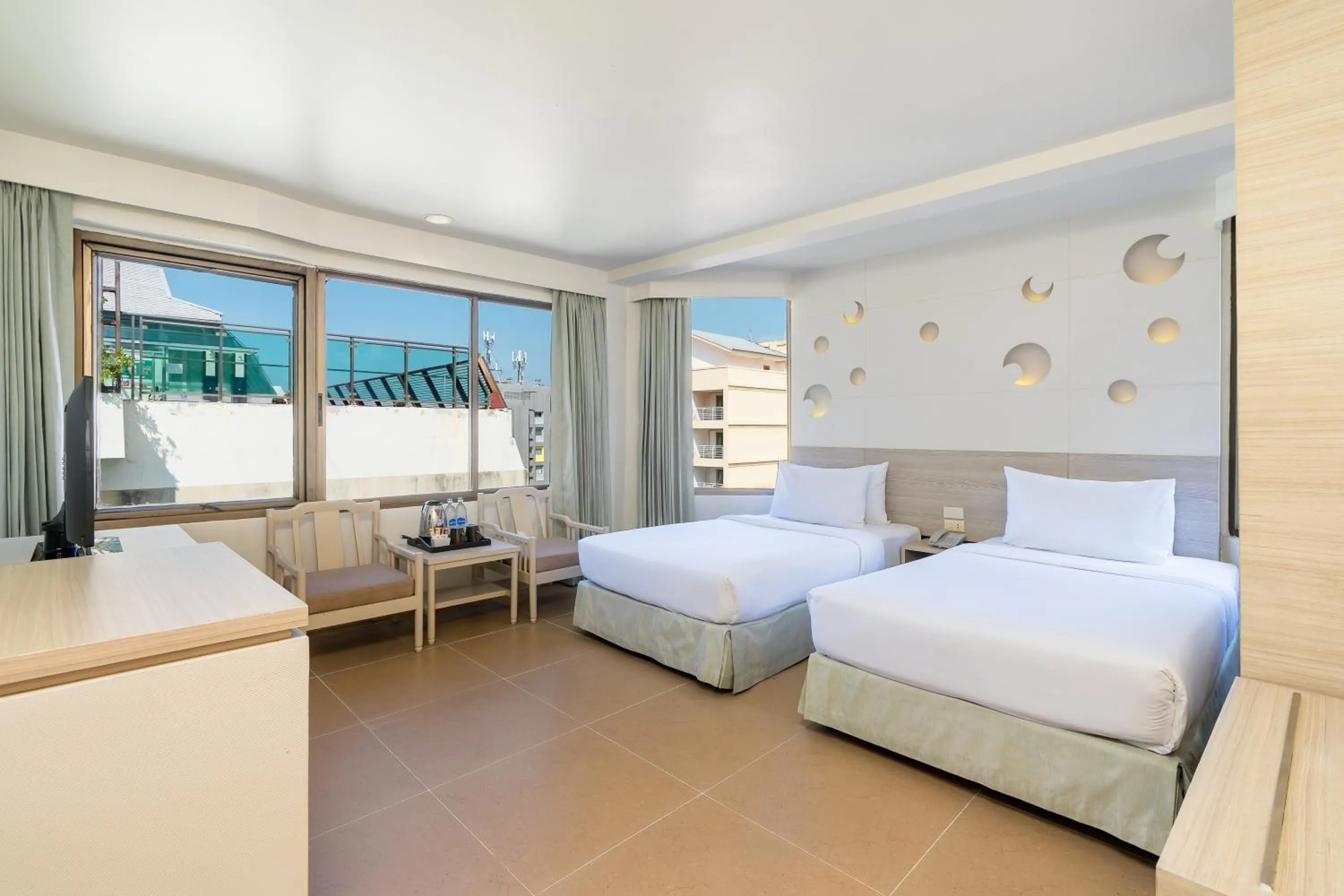 Bed in Sunshine Hotel & Residences