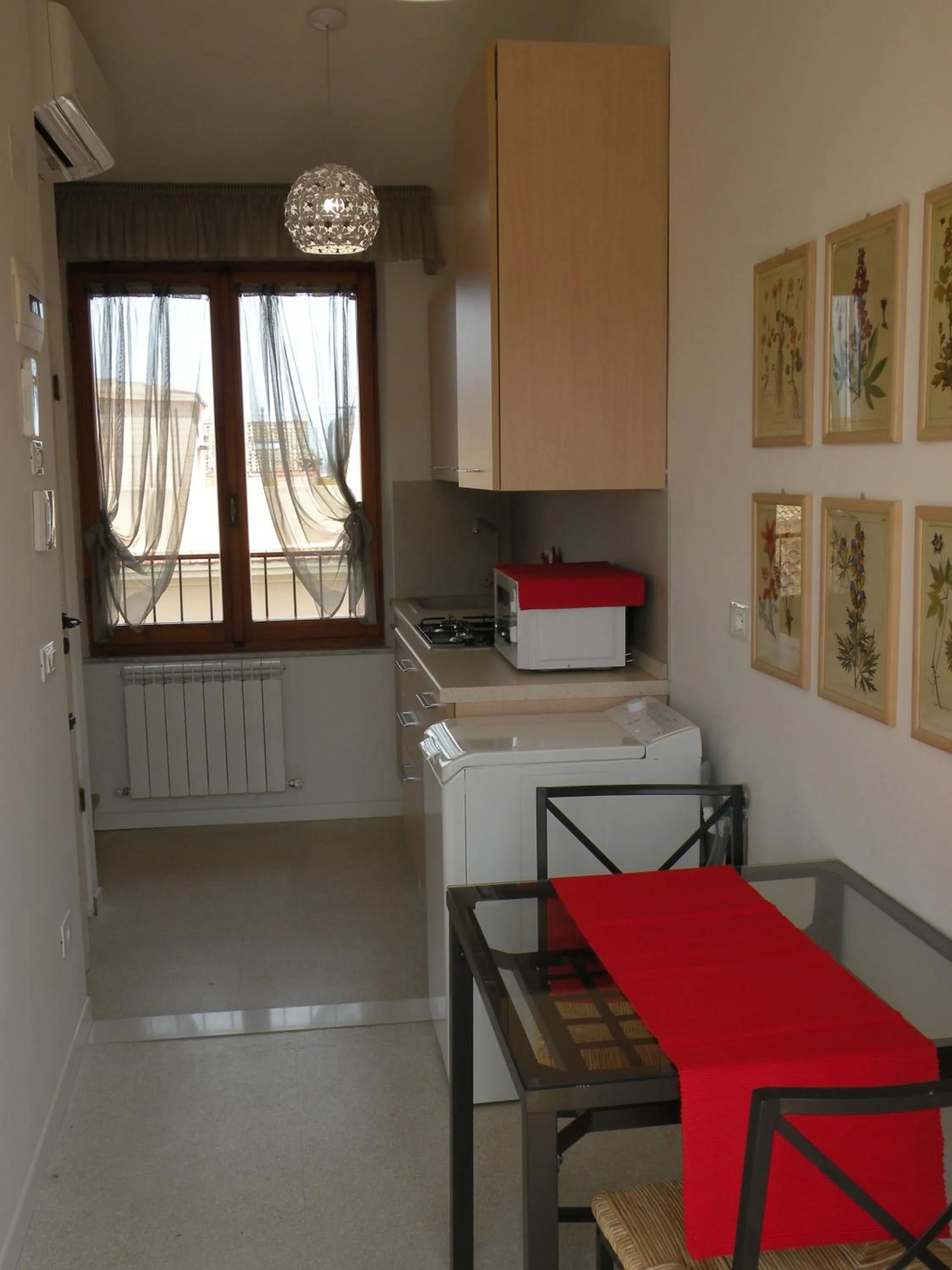 Kitchen or kitchenette in La Casa sul Corso B&B