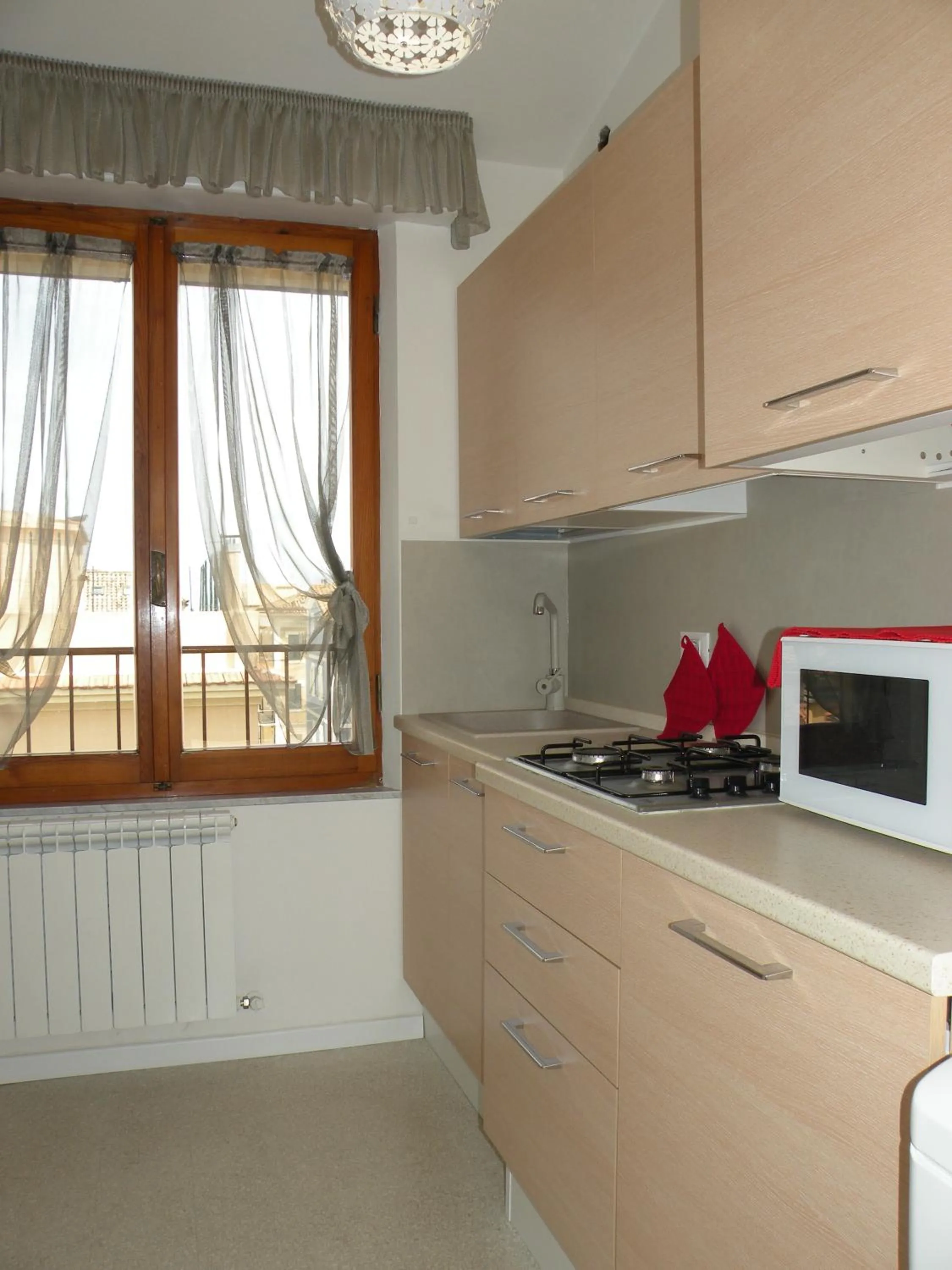 Kitchen or kitchenette in La Casa sul Corso B&B