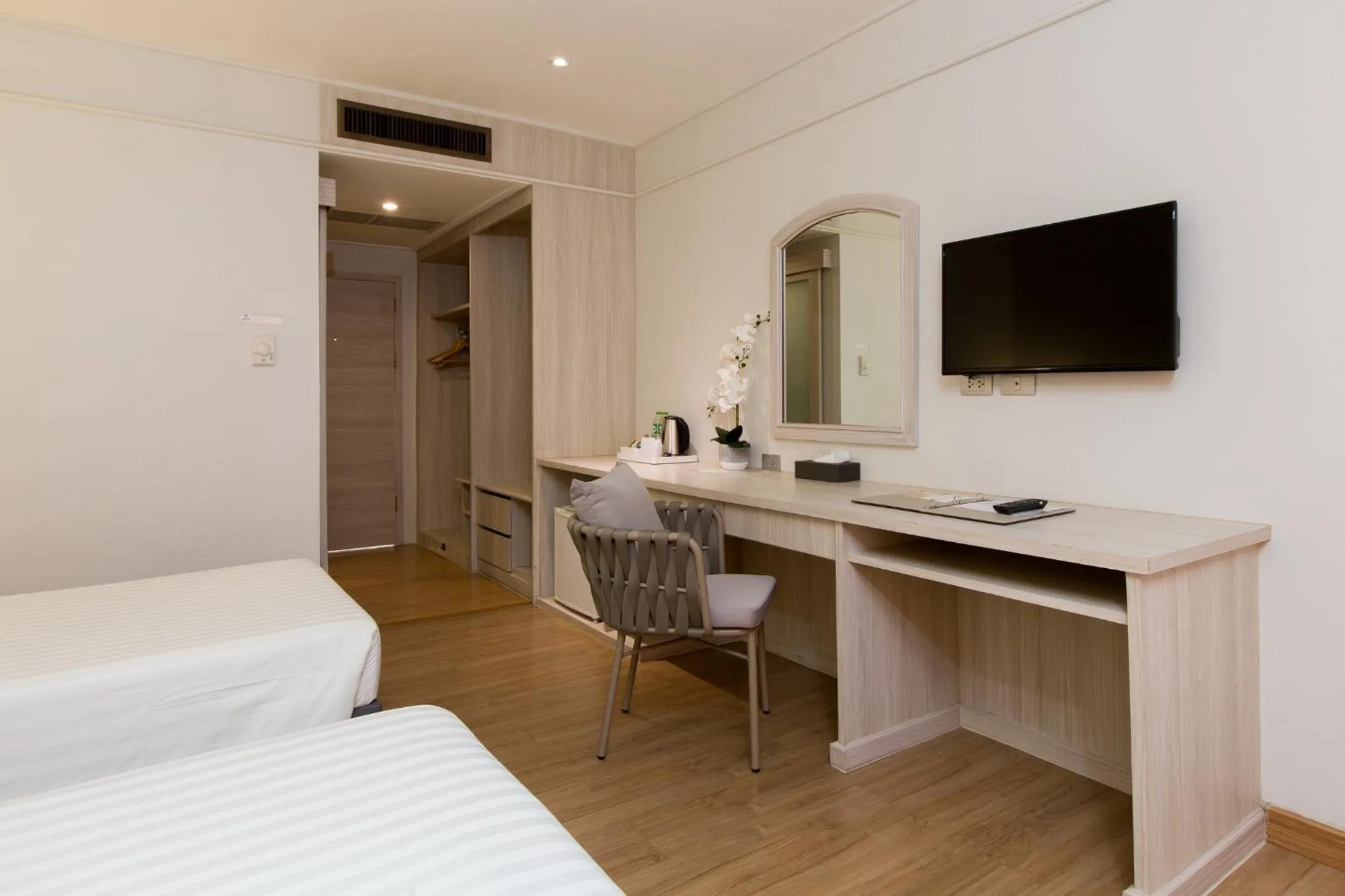 wardrobe, Bed in Coconut Village Resort Phuket - SHA Extra Plus