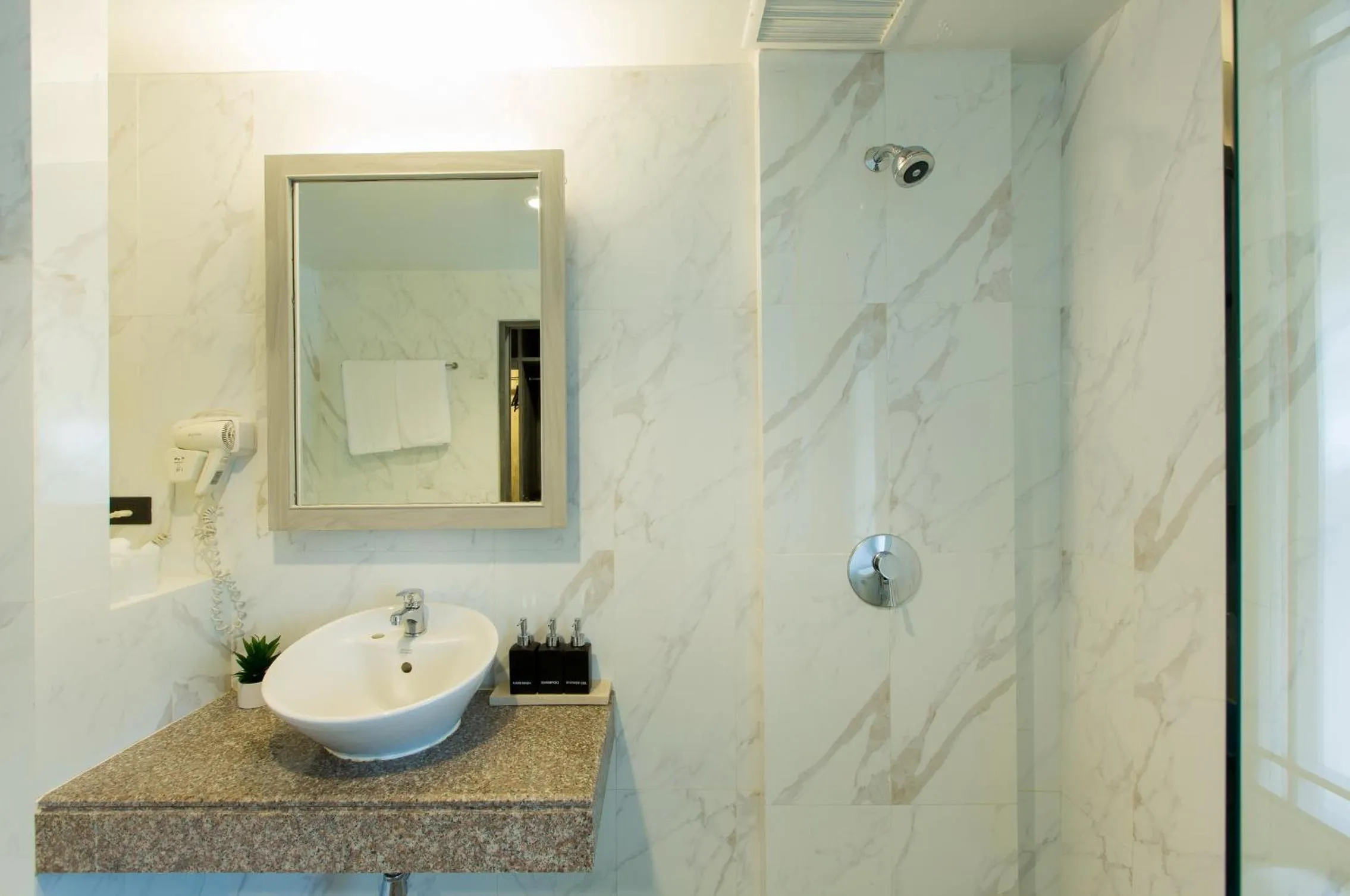 Shower in Coconut Village Resort Phuket - SHA Extra Plus