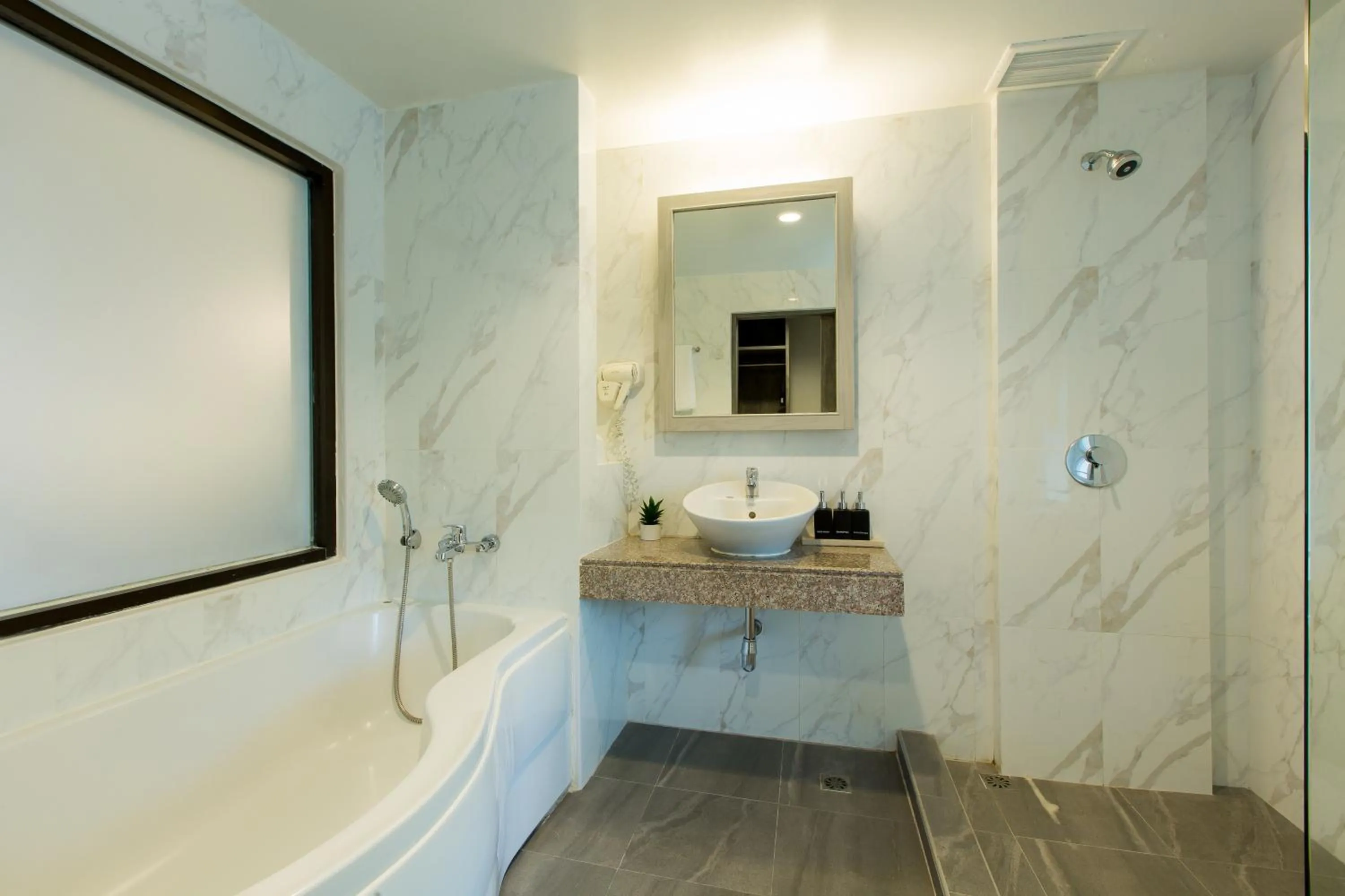 Toilet in Coconut Village Resort Phuket - SHA Extra Plus