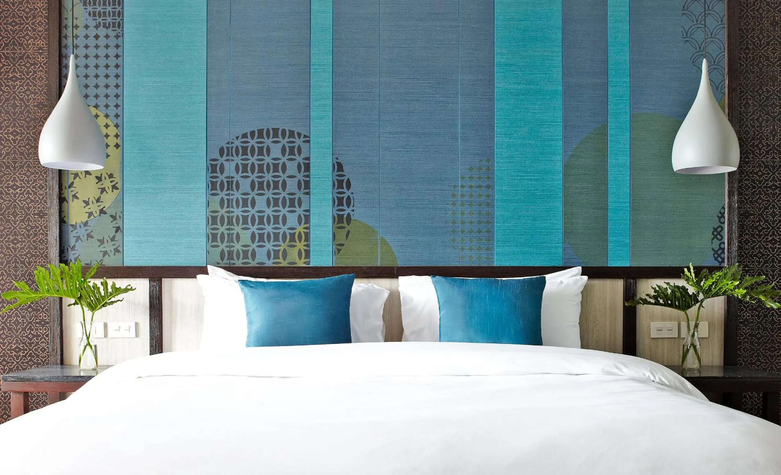 Bed in Sareeraya Villas & Suites