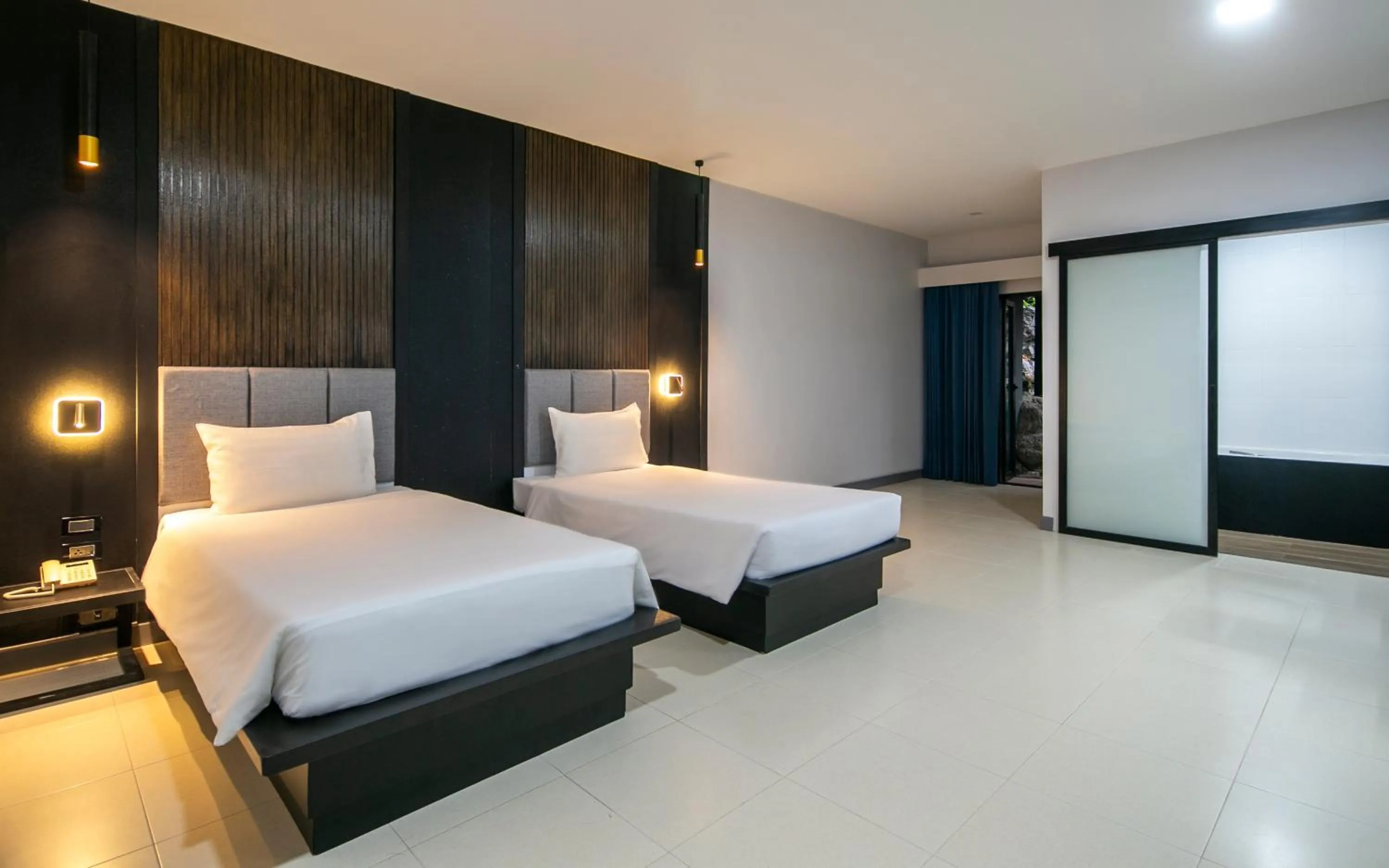 Photo of the whole room, Bed in Tuana Hotels The Phulin Resort