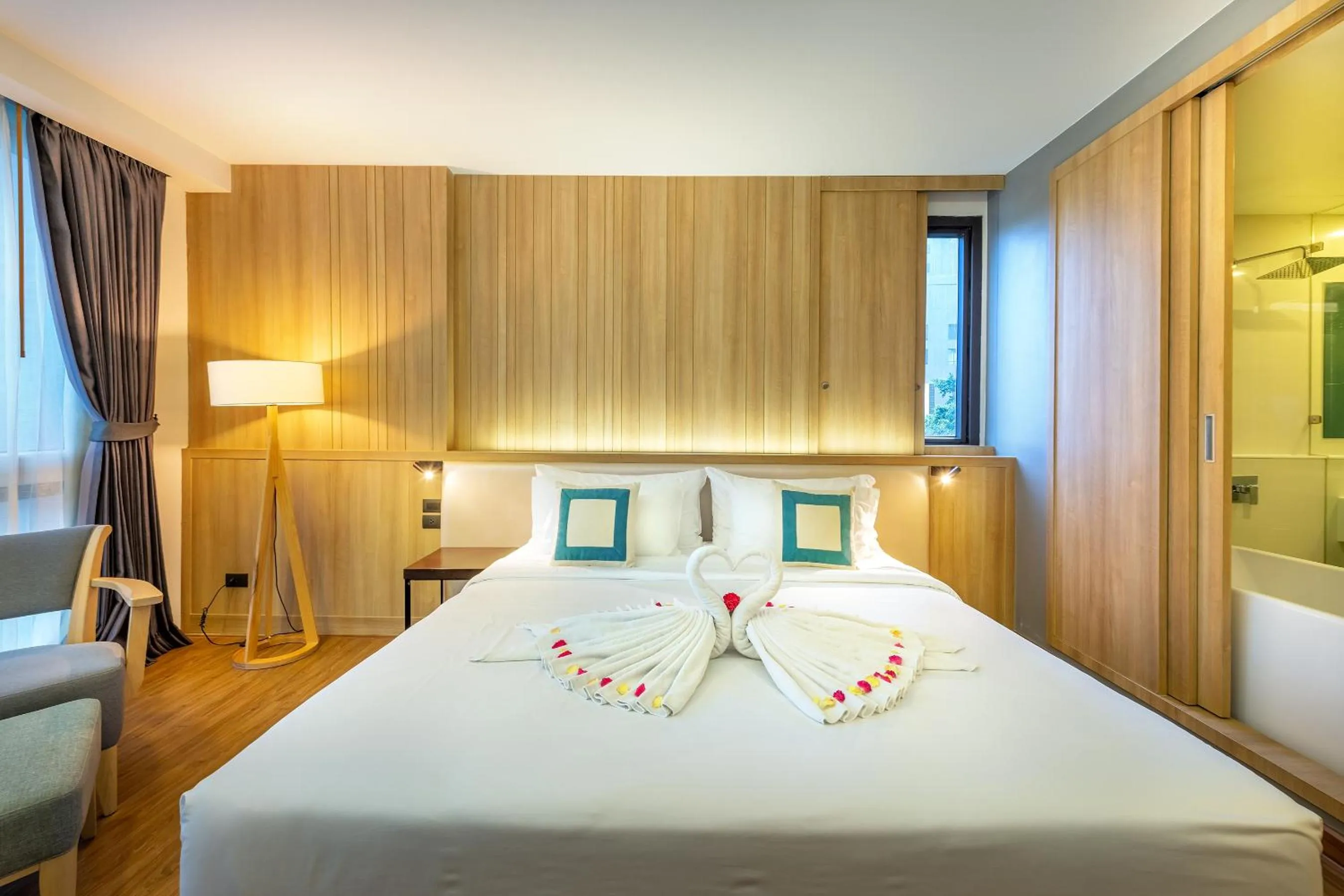 Bed in PLAAI Prime Hotel Rayong SHA Extra Plus