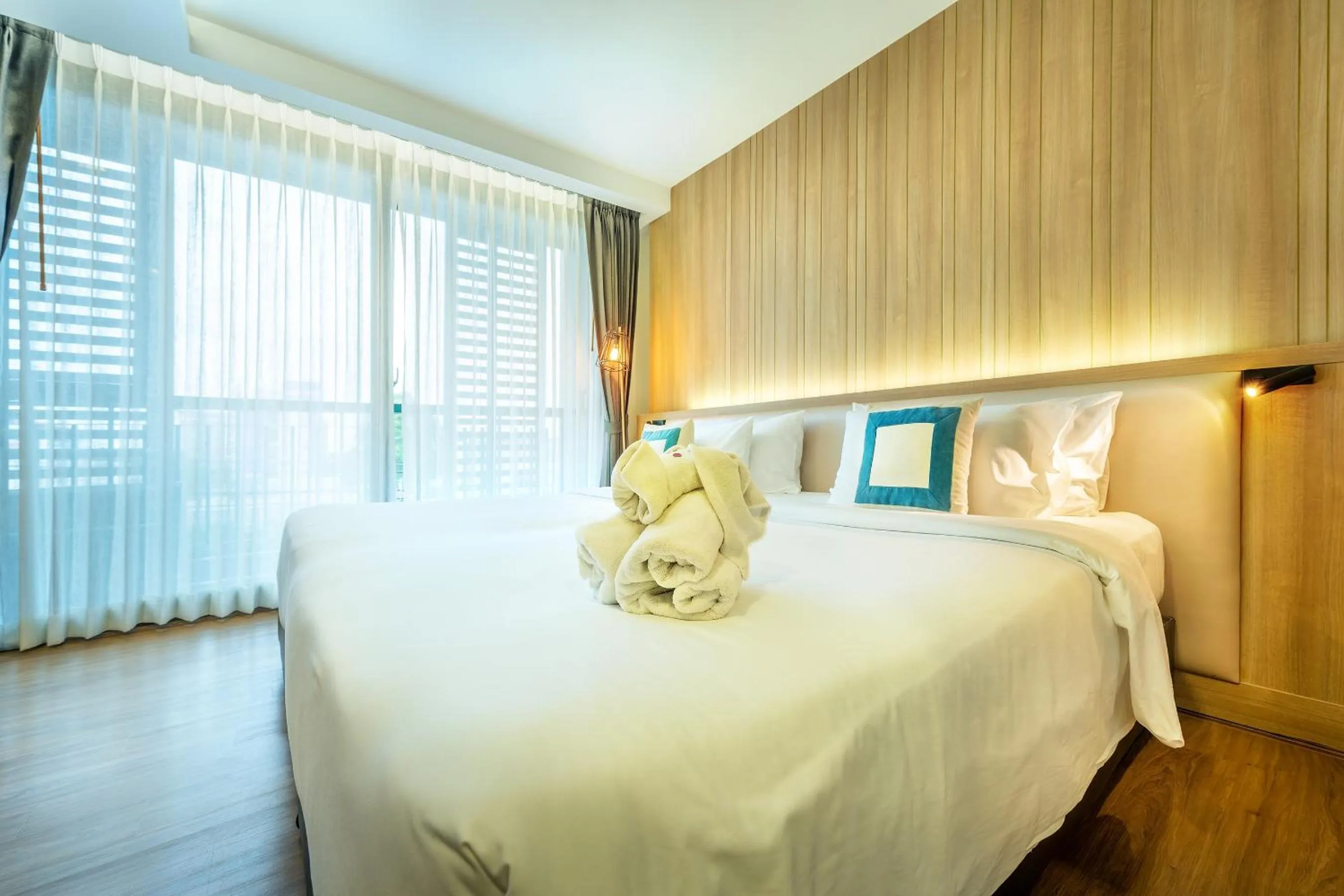 Bed in PLAAI Prime Hotel Rayong SHA Extra Plus