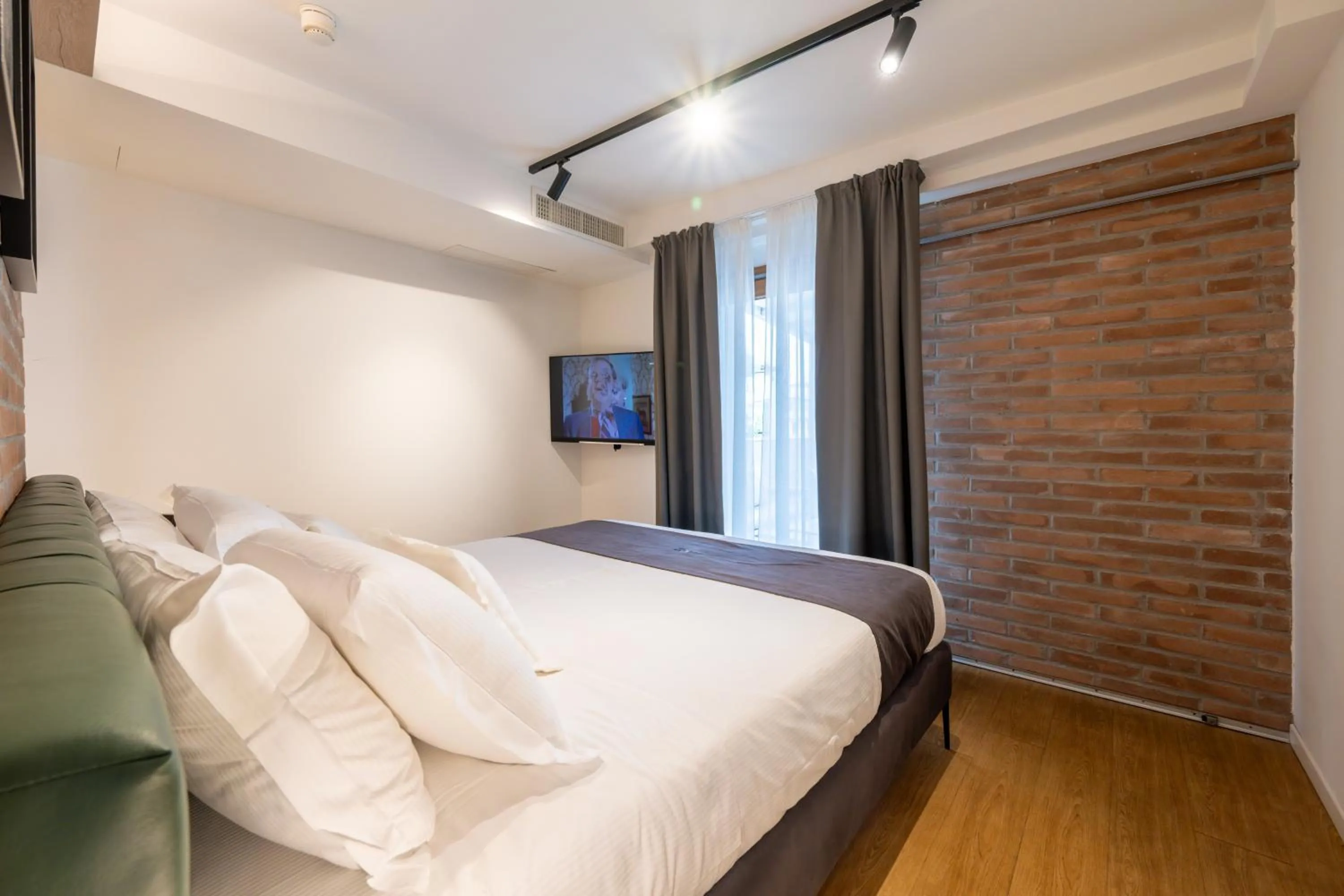 Bed in Meg Lifestyle Hotel & Apartaments