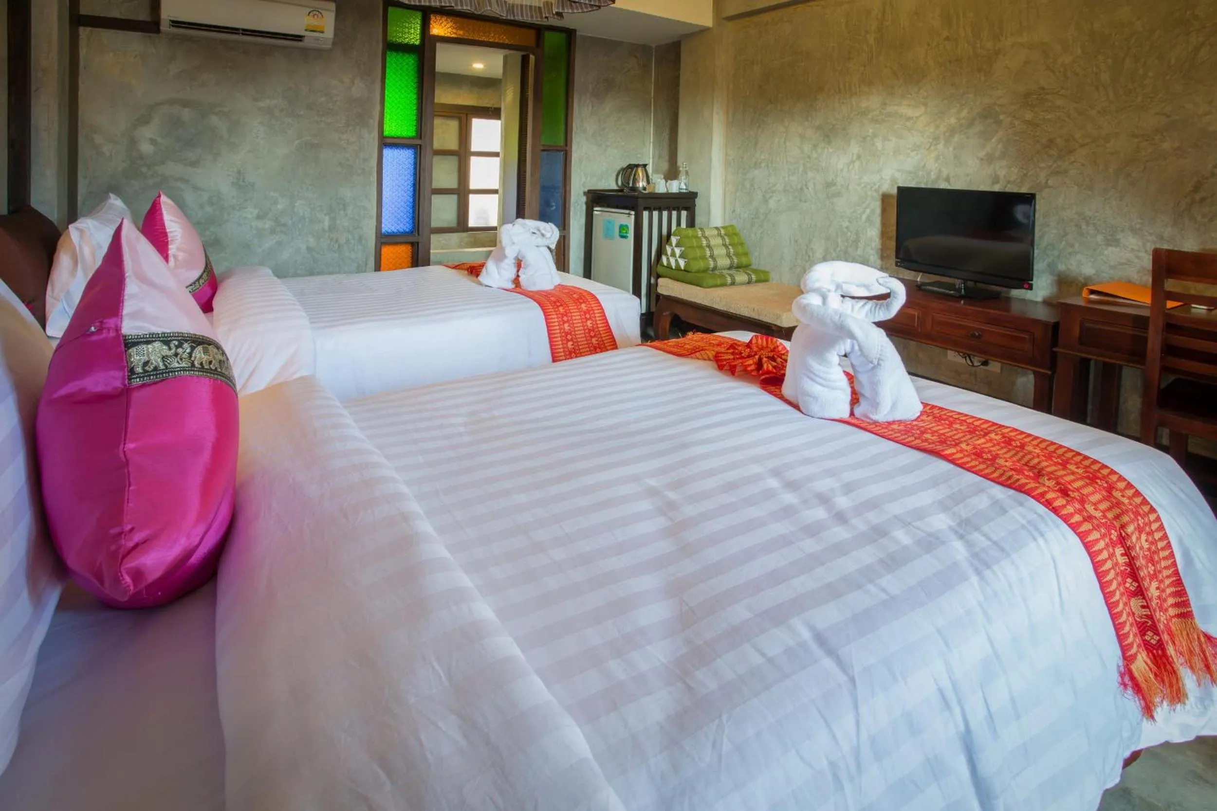 Bed in Rainforest ChiangMai Hotel