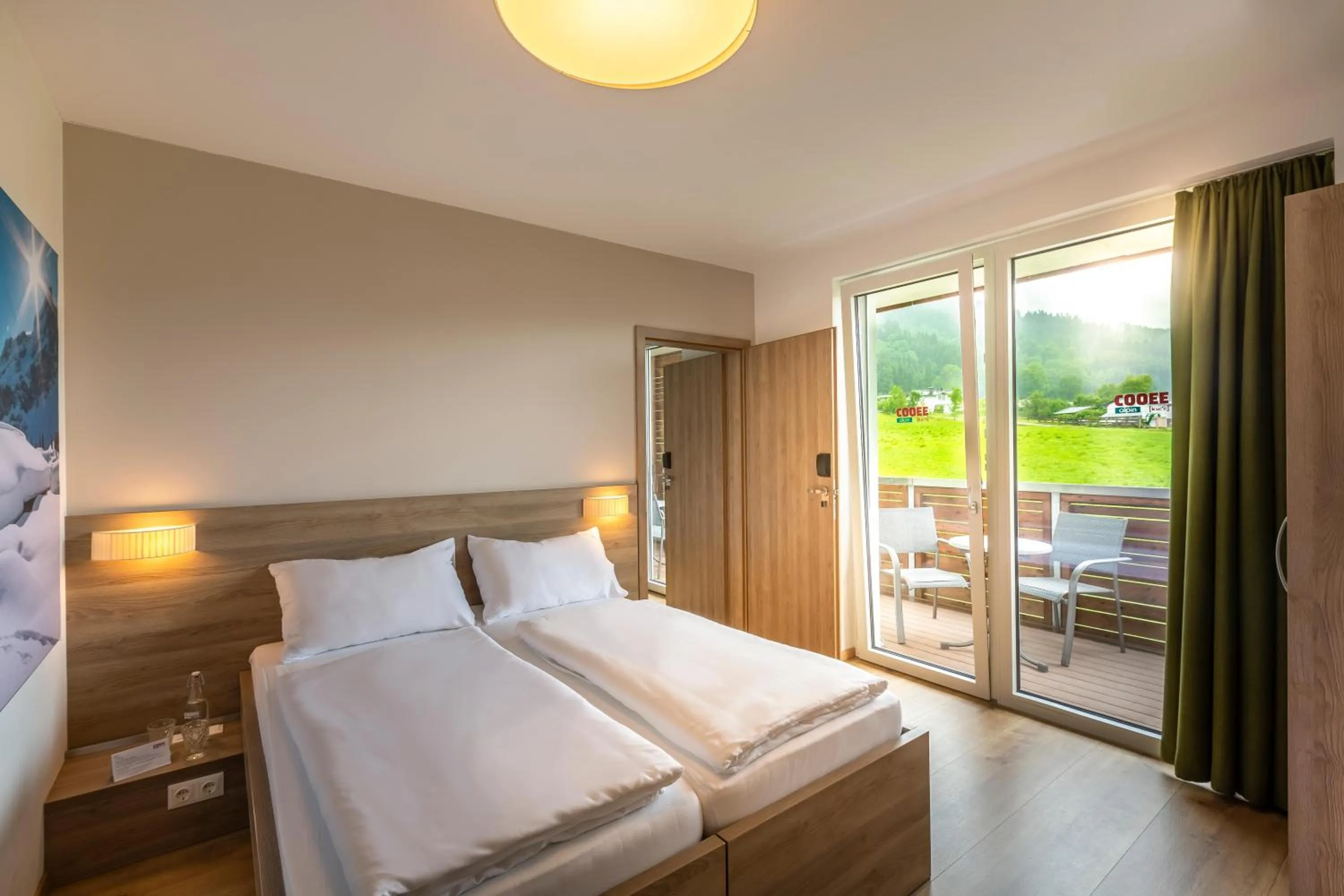 Photo of the whole room, Bed in COOEE alpin Hotel Kitzbüheler Alpen