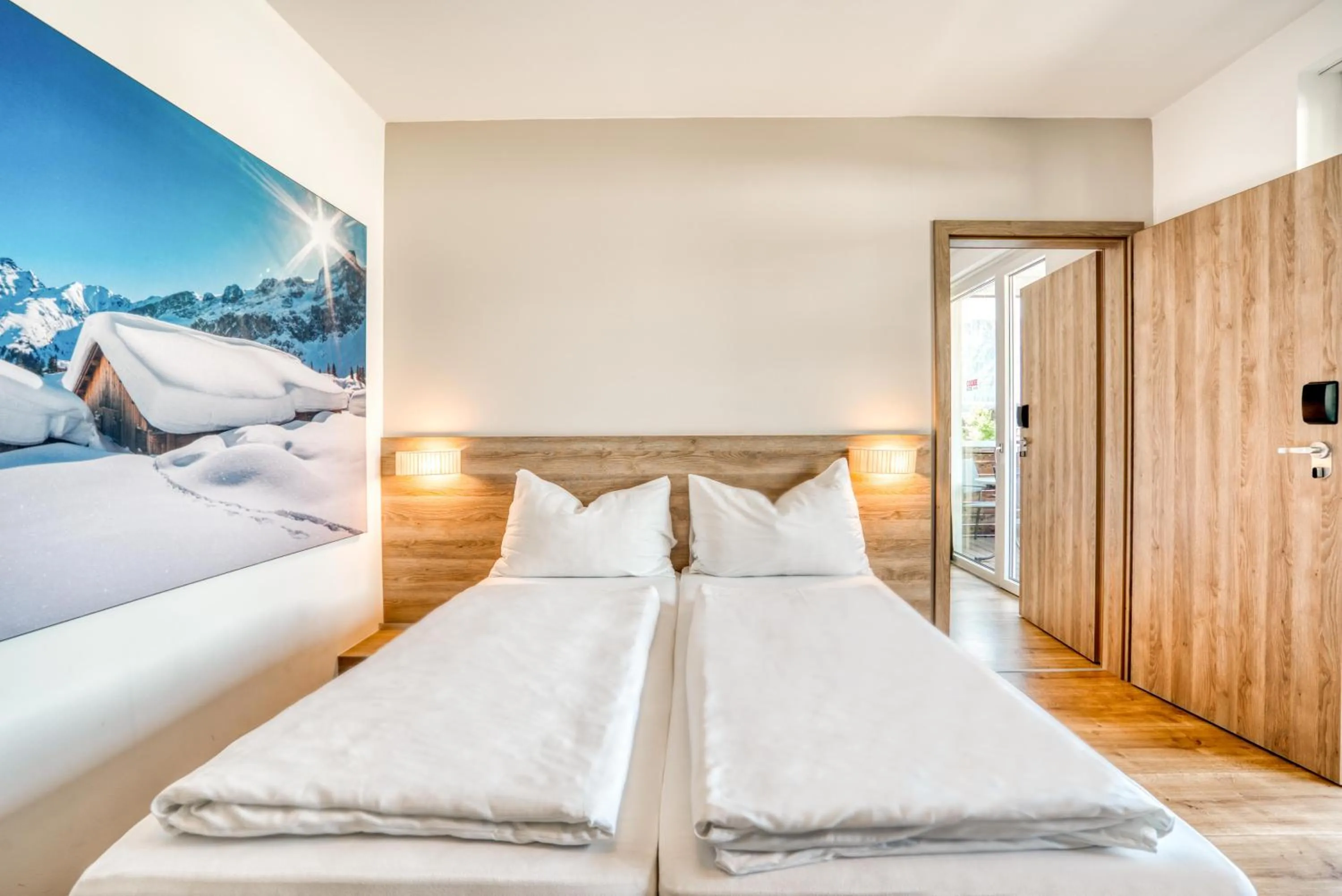 Photo of the whole room, Bed in COOEE alpin Hotel Kitzbüheler Alpen