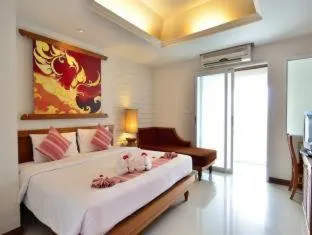 Bed in First Bungalow Beach Resort